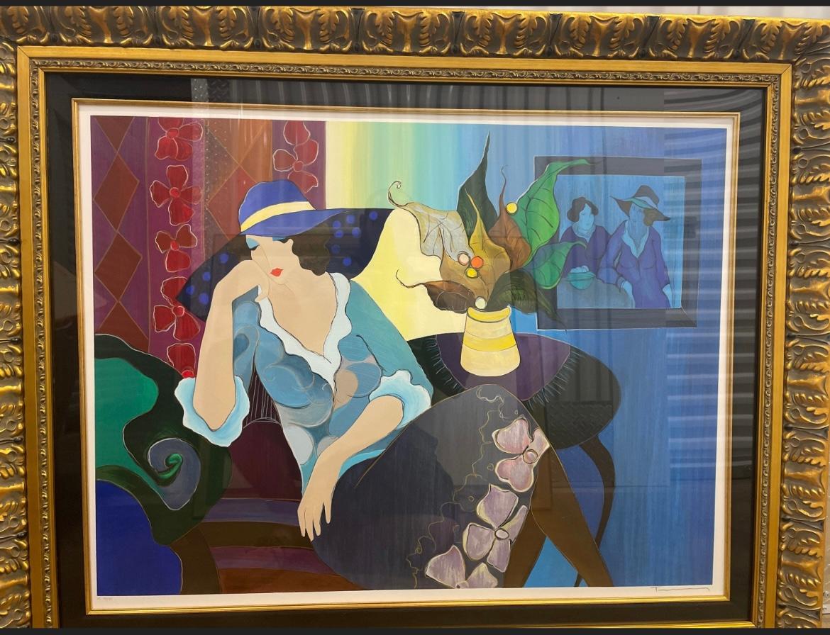 This is an Itzchak Tarkay, “Quiet Evening” Signed serigraph framed. In good condition. Measures 44x37