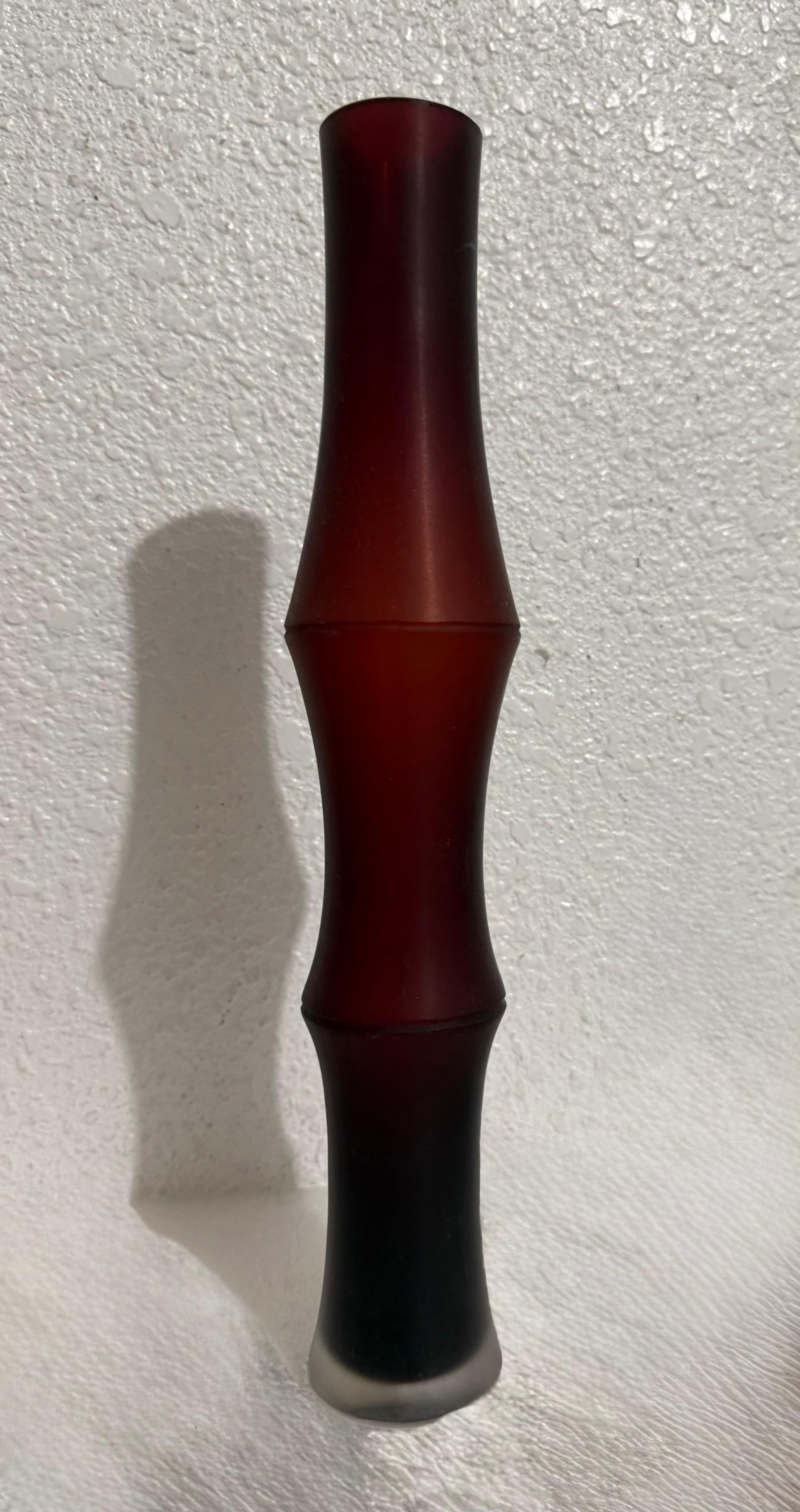 Ivan Baj for Arcade Column Vase
This has an African or Aboriginal tribal pattern to it. 
Hand etch signed on underside, Bears original label.
Hand blown, tall black oval vases having hand cut design to exterior.
Height: 14.5 inches, Width: 2 1/2