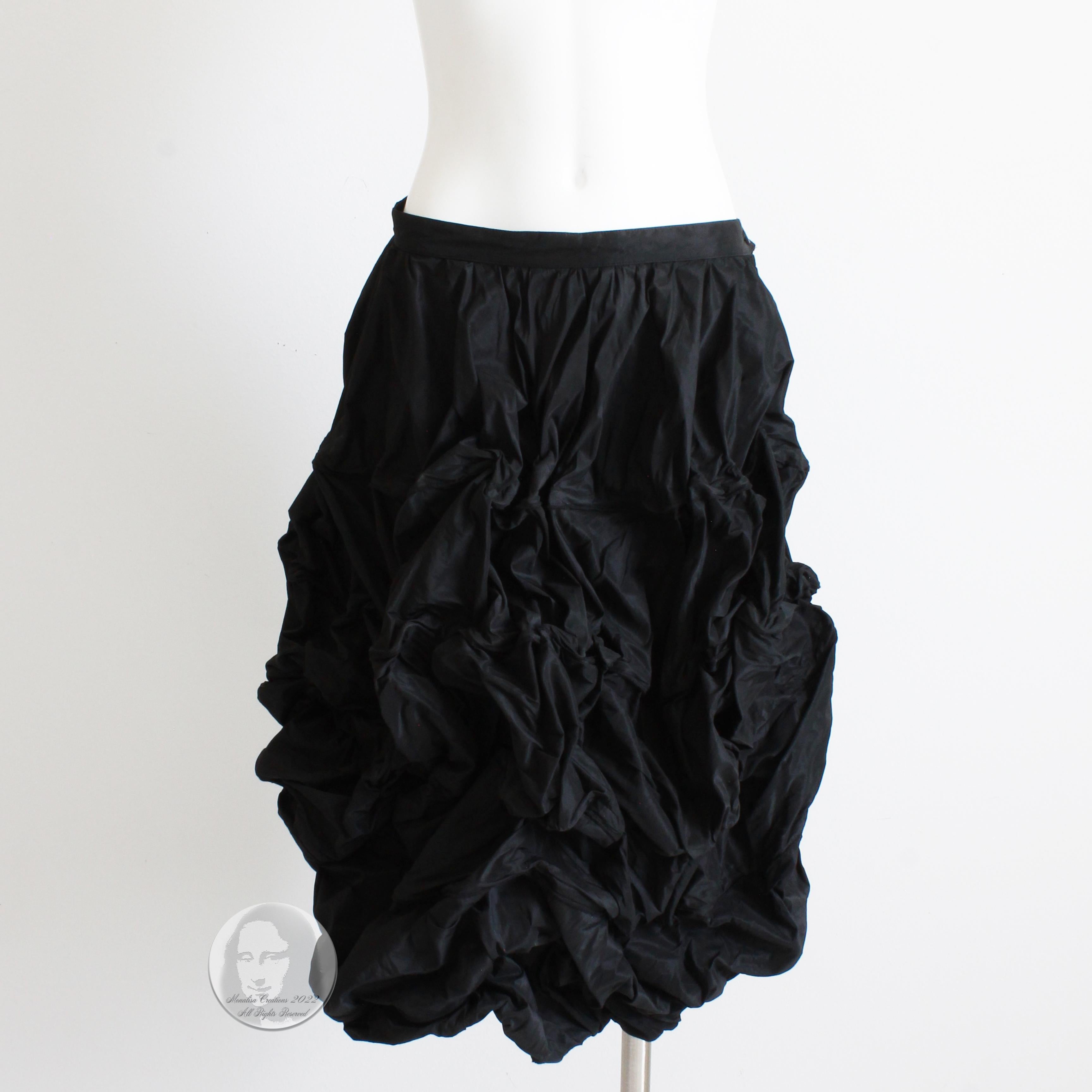 This incredibly rare sculptural skirt was made by Ivan Grundahl Copenhagen in 2010. Made from black microfiber, it features flexible wire boning throughout, allowing one to sculpt and shape the piece in a variety of ways, including use as an over