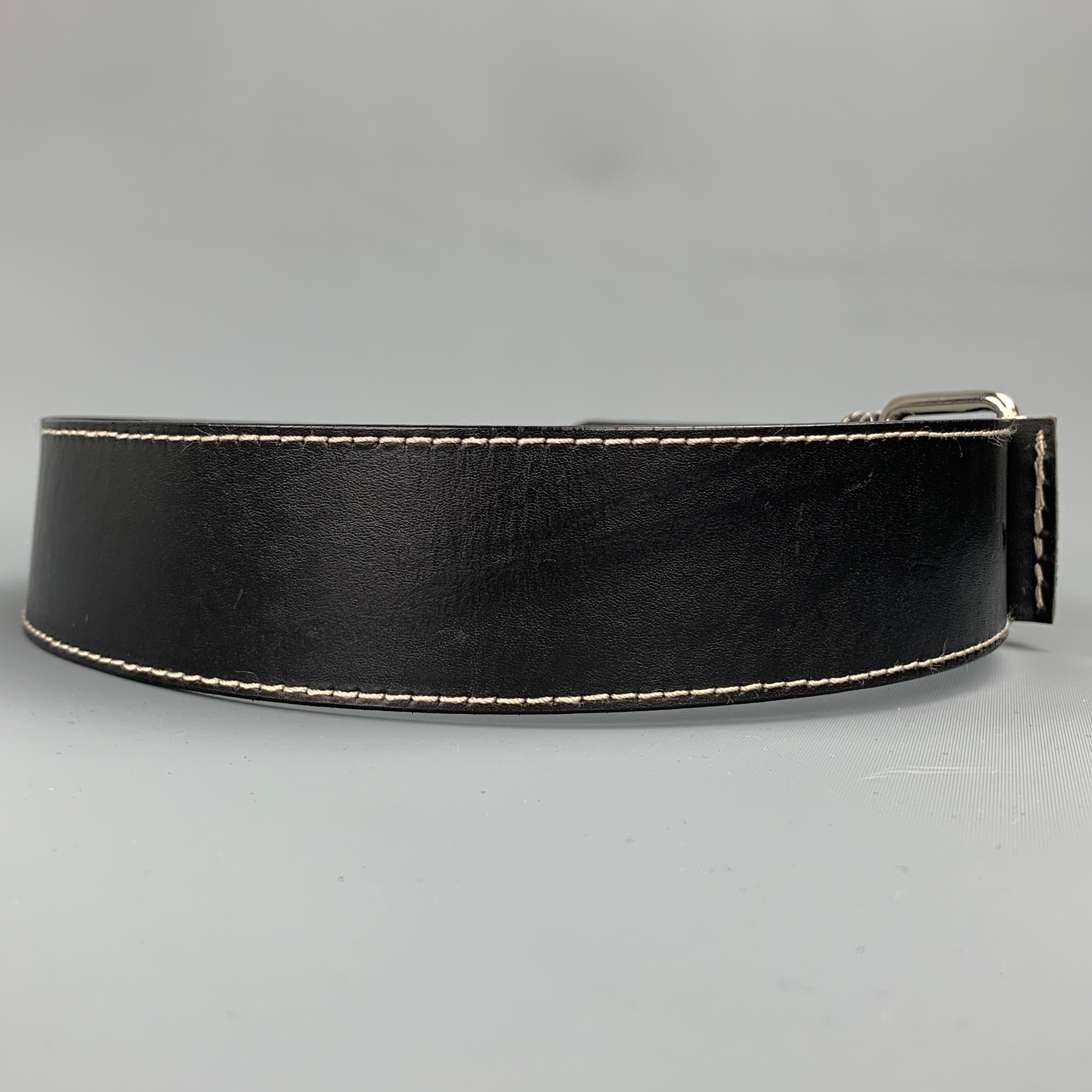 IVAN GRUNDAHL belt comes i a black leather with contrast stitching featuring a silver tone buckle.

Very Good Pre-Owned Condition.
Marked: 80

Length: 38 in. 
Width: 2 in. 
Fits: 28 in. - 32 in. 
Buckle: 1.5 in. 