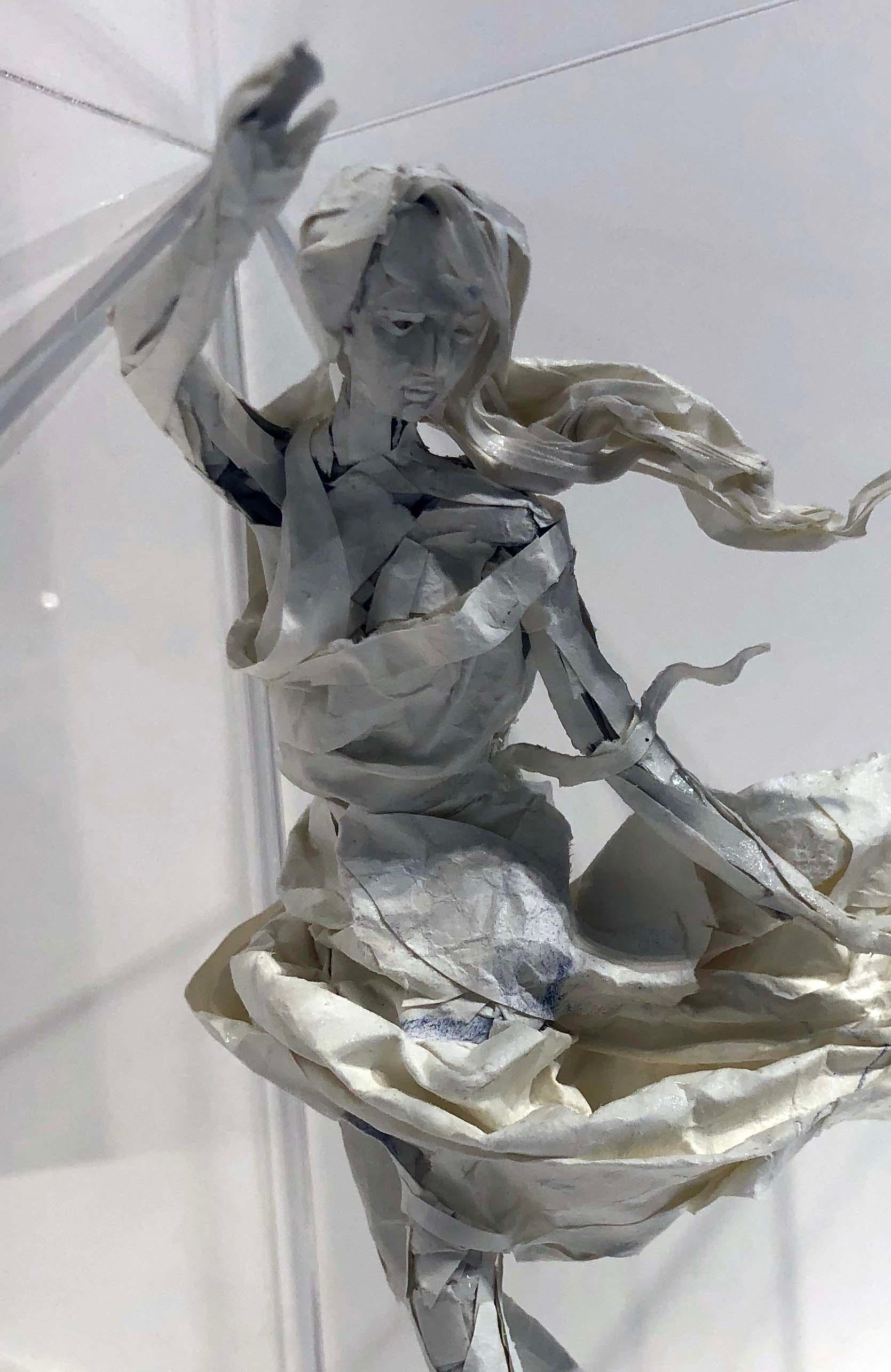 The billowing skirt and fly-away scarf on Ivan Markovic's paper sculpture, 