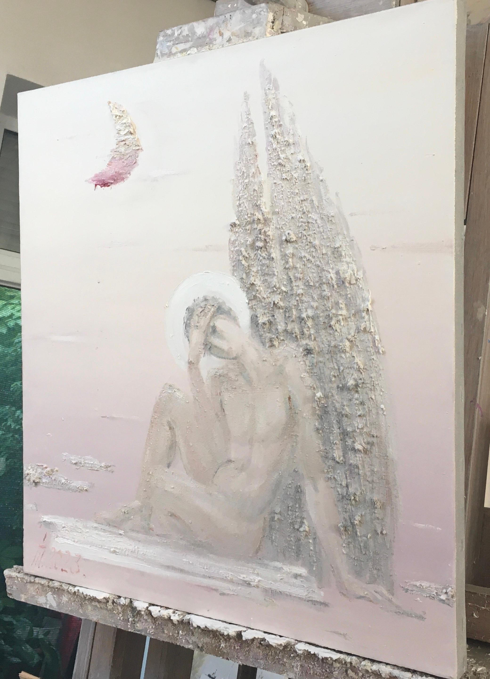 The image depicts an artistic scene in soft pastel colors.

- **Foreground**: The focus is on a figure sitting on the ground. The figure has wings and resembles an angel. It is leaning forward, holding its head in its hand, which may indicate deep