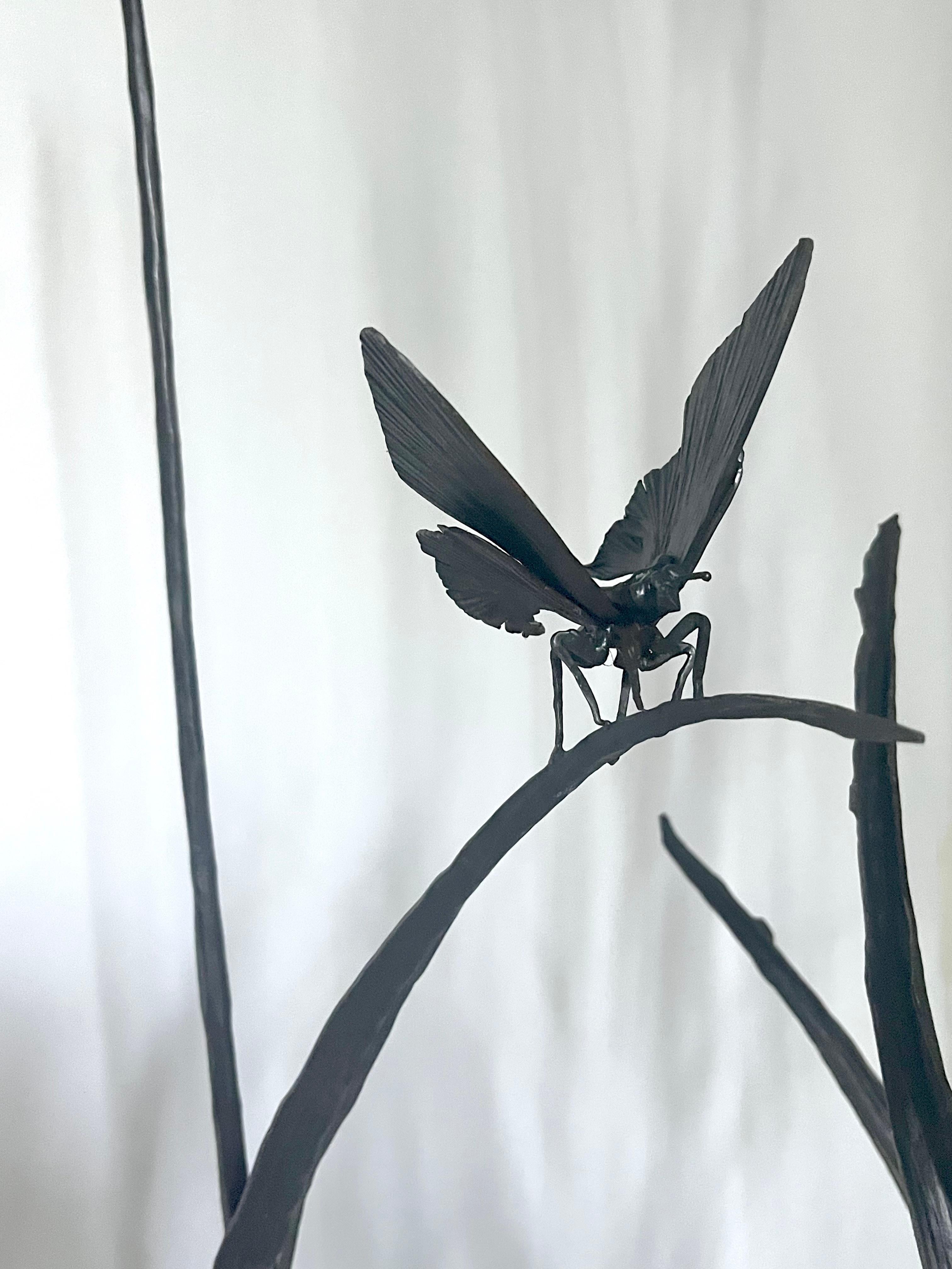 Rich and exuberant hand-forged iron reed with naturally folded leaves and a butterfly that has just landed.

The sculpture is perfectly suited to outdoor and indoor environments. It is easily movable and recreates a peaceful corner of nature