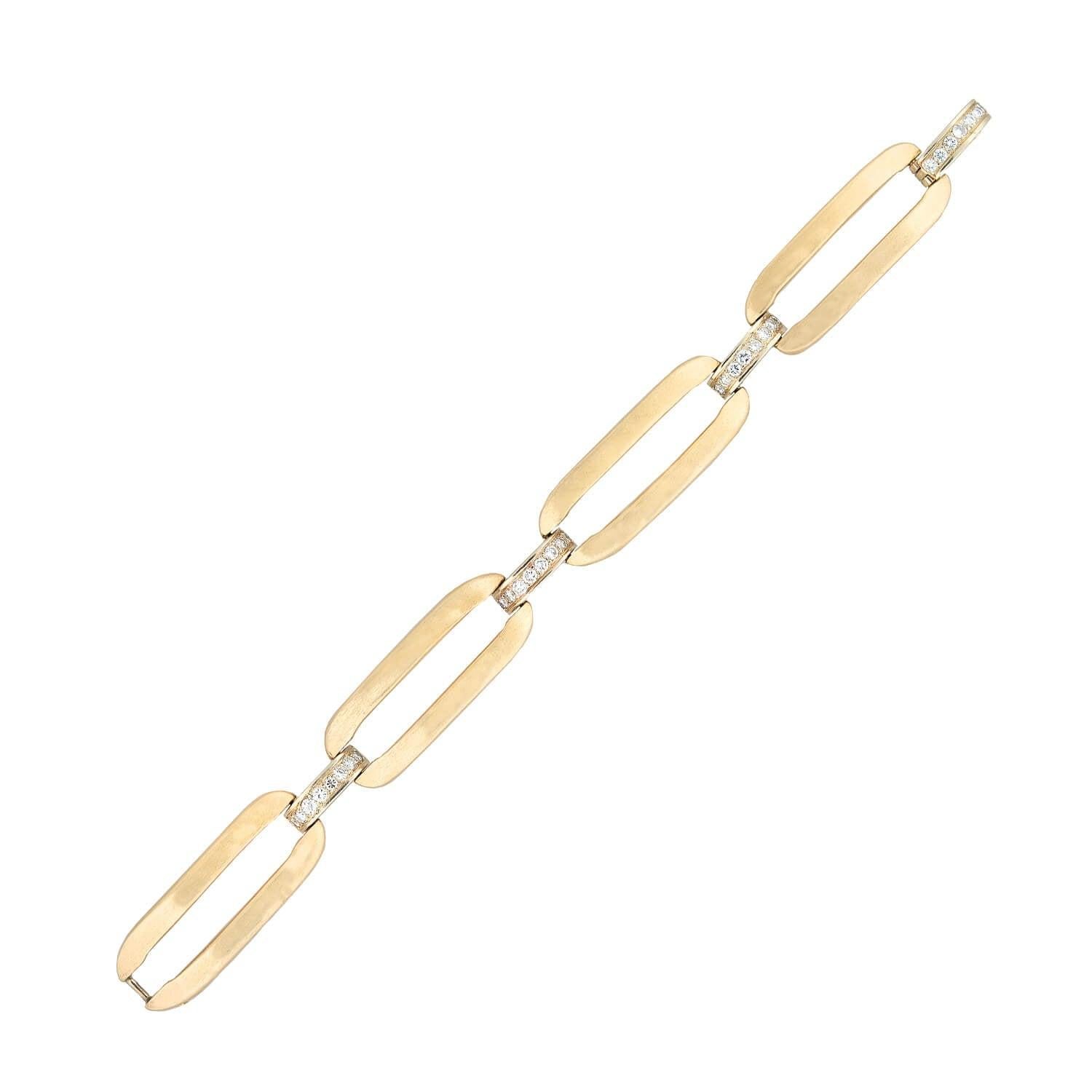 A beautiful contemporary link bracelet by Ivanka Trump Fine Jewelry! Crafted in 14kt yellow gold, this bracelet features four elongated links with a gently brushed texture. Four delicate links secure the golden links, three of which are set with