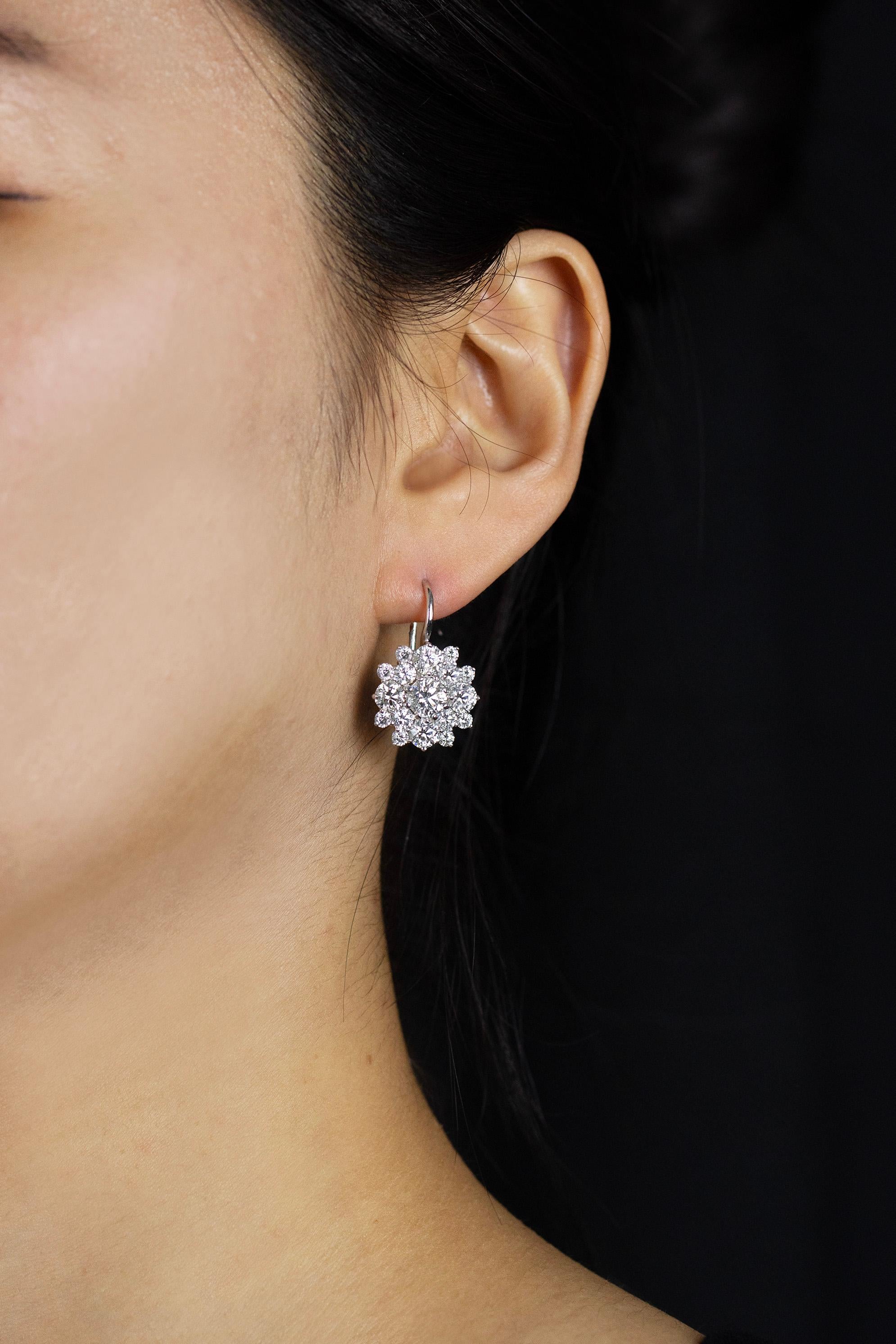 Back in the spotlight with this dazzling pair of earrings created by Ivanka Trump. Creative and unique starburst design encrusted with round brilliant diamonds weighing a stunning 5.80 carats total. Attached to hand-crafted 18k white gold french