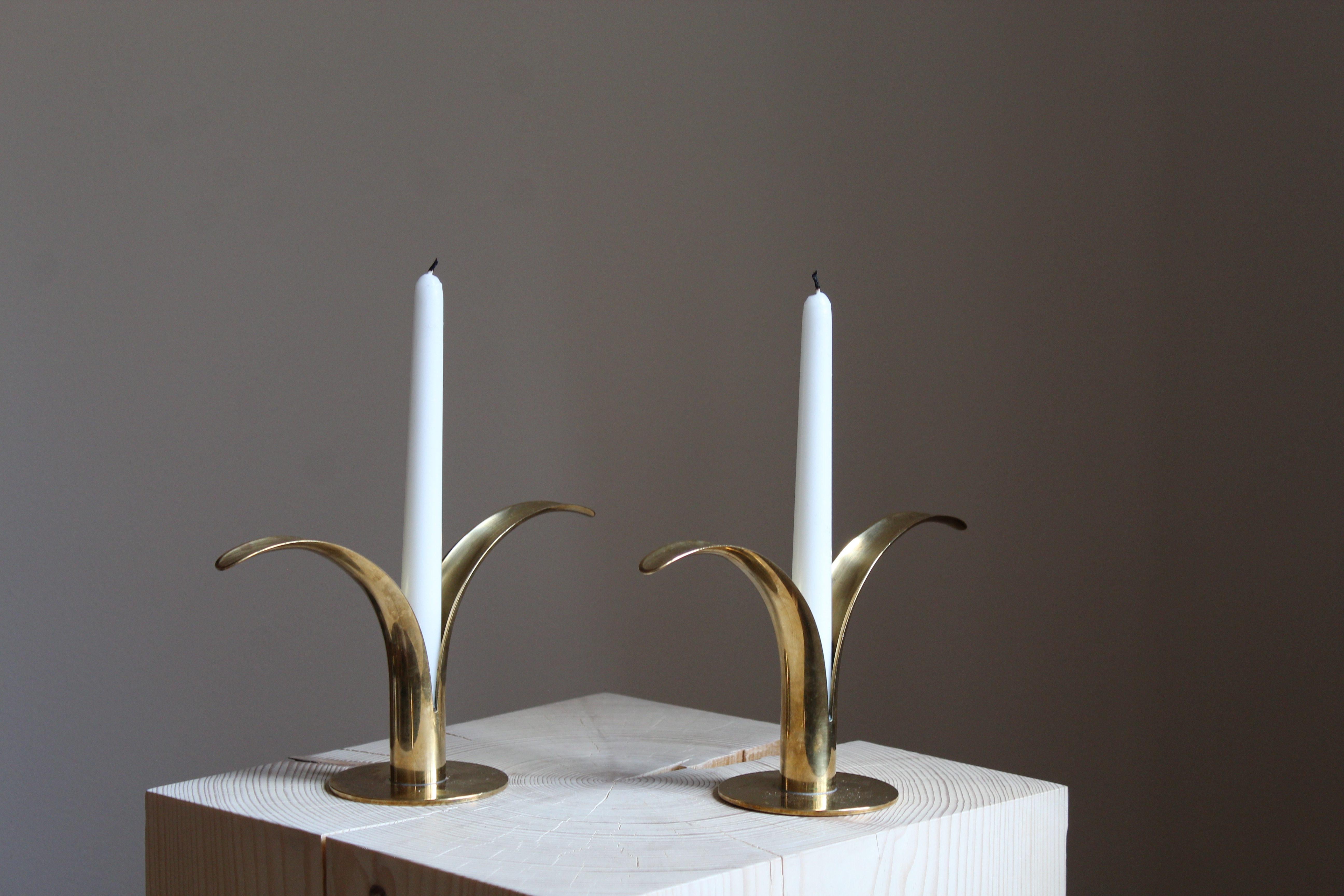 A pair of organic candlesticks / candleholders, designed by Ivar Åhlenius Björk for Ystad Metall, Sweden, 1950s. In brass and lacquered steel. Stamped.

Other designers of the period include Piet Hein, Paavo Tynell, Josef Frank, and Jean