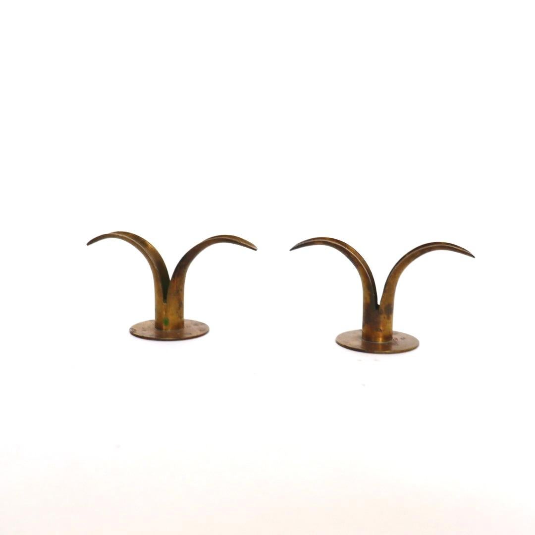 Rare Ivar Åhlenius Björk, Lily / Liljan Candlestickscandle holders made by Ystad Metal in Sweden. Please note these are the much rarer smaller versions. Price is for a pair. Sold in pairs only (3 Pairs available).

These gorgeous candle holders are