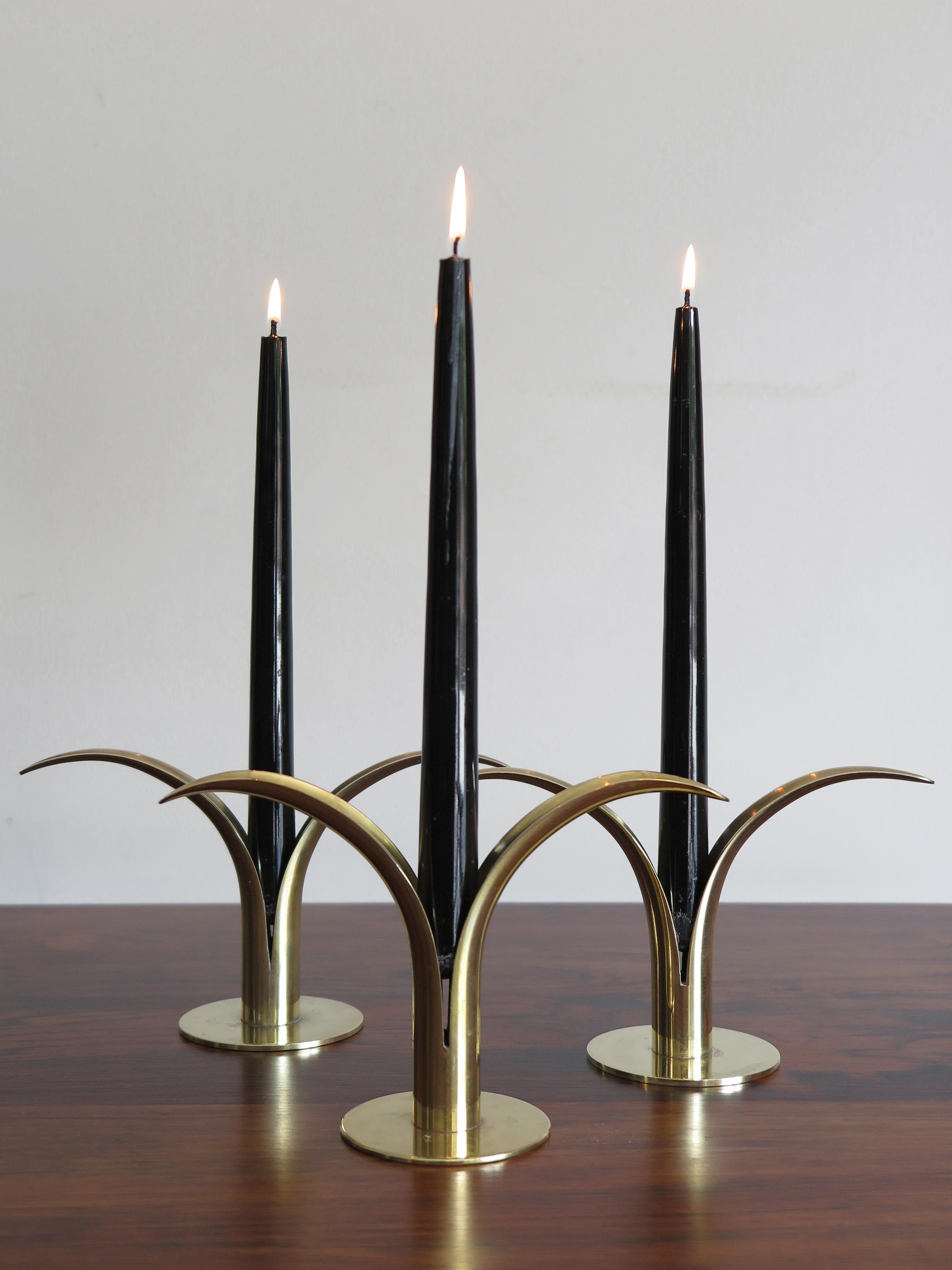 Liljan candleholders set in yellow brass by Ivar Ålenius Björk for Ystad Metall, Sweden, circa 1940.

Please note that the items are original of the period and this shows normal signs of age and use.