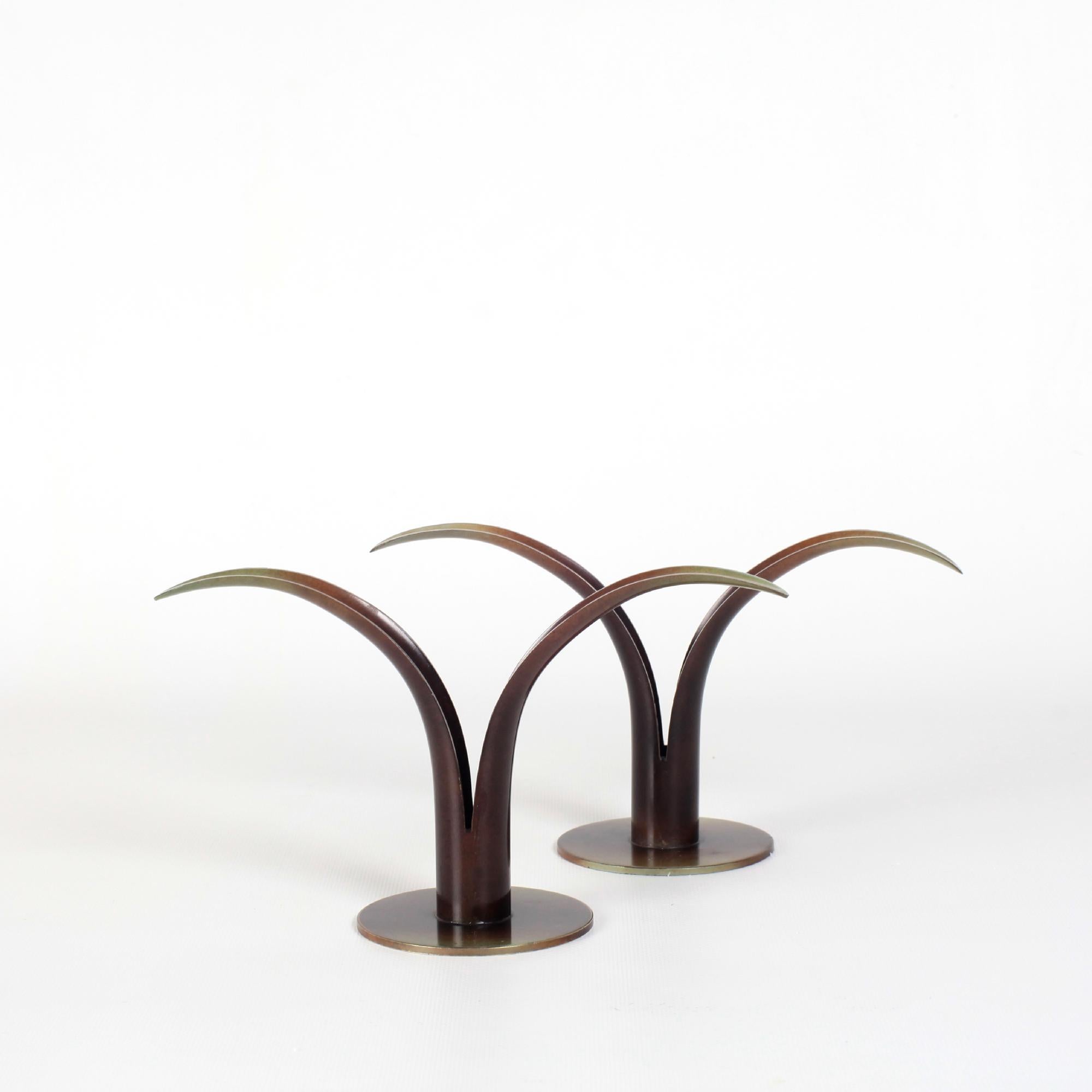 Rare pair of candlesticks model Lily
created in 1939 for the New York World's Fair
by Ivar Ålenius Björk for Ystad Brons
Sweden 1940s
Brass with brown and green bronze patina finish
Marked under the base with the artist's IAB monogram
and