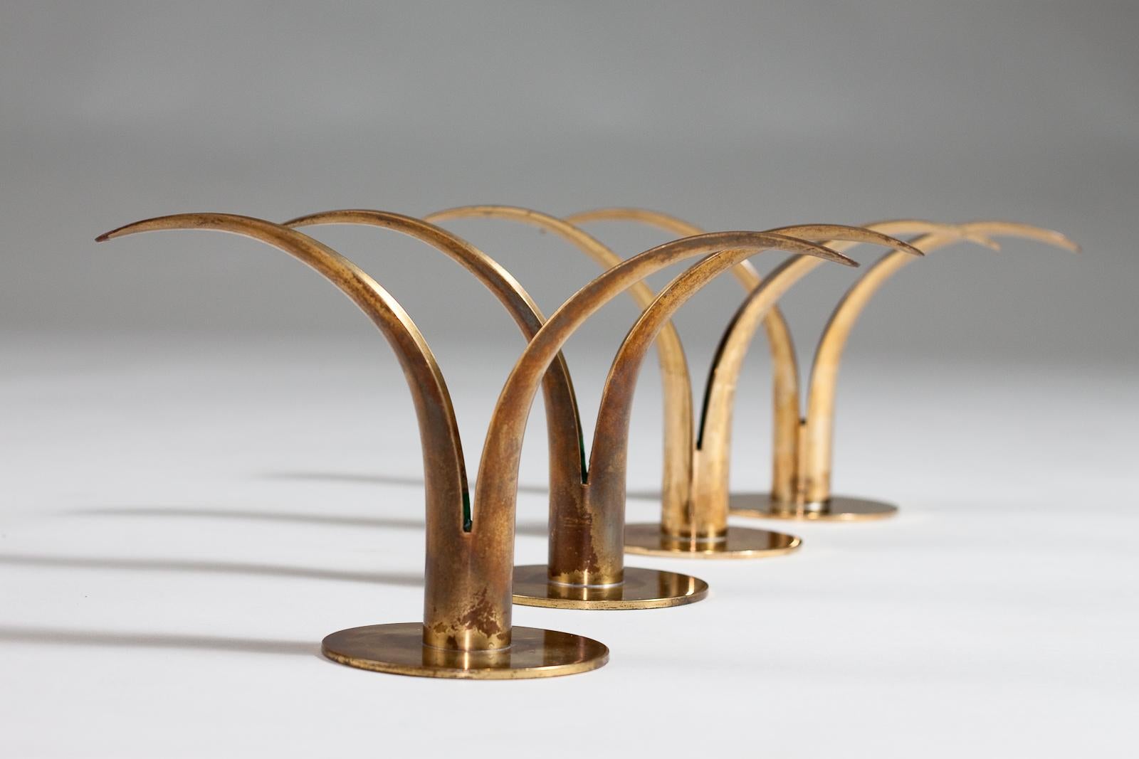 Swedish Ivar Ålenius Björk, set of 4 Liljan brass candlesticks, Ystad Metall, 1940's  For Sale