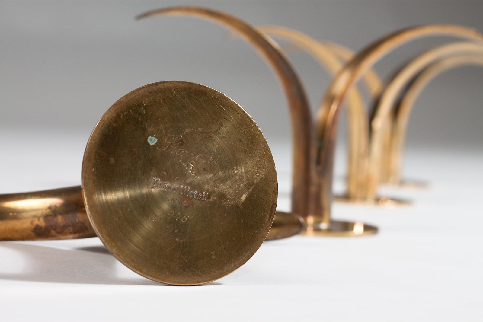 Mid-20th Century Ivar Ålenius Björk, set of 4 Liljan brass candlesticks, Ystad Metall, 1940's