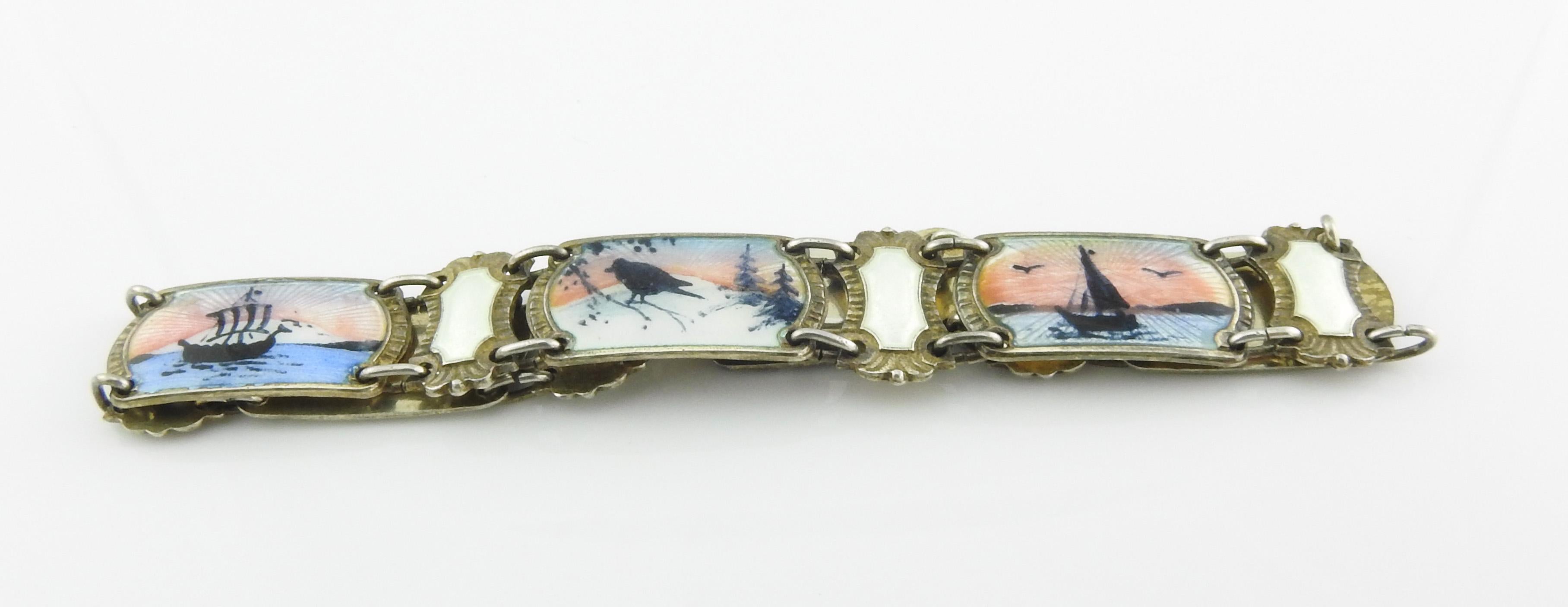 Ivar T. Holth Norway 830 and sterling silver guilloche enamel Norwegian scene link bracelet.

Marked: H in circle, STERLING, NORWAY.
H in circle, 830S, NORWAY.

Measures: 7 1/4