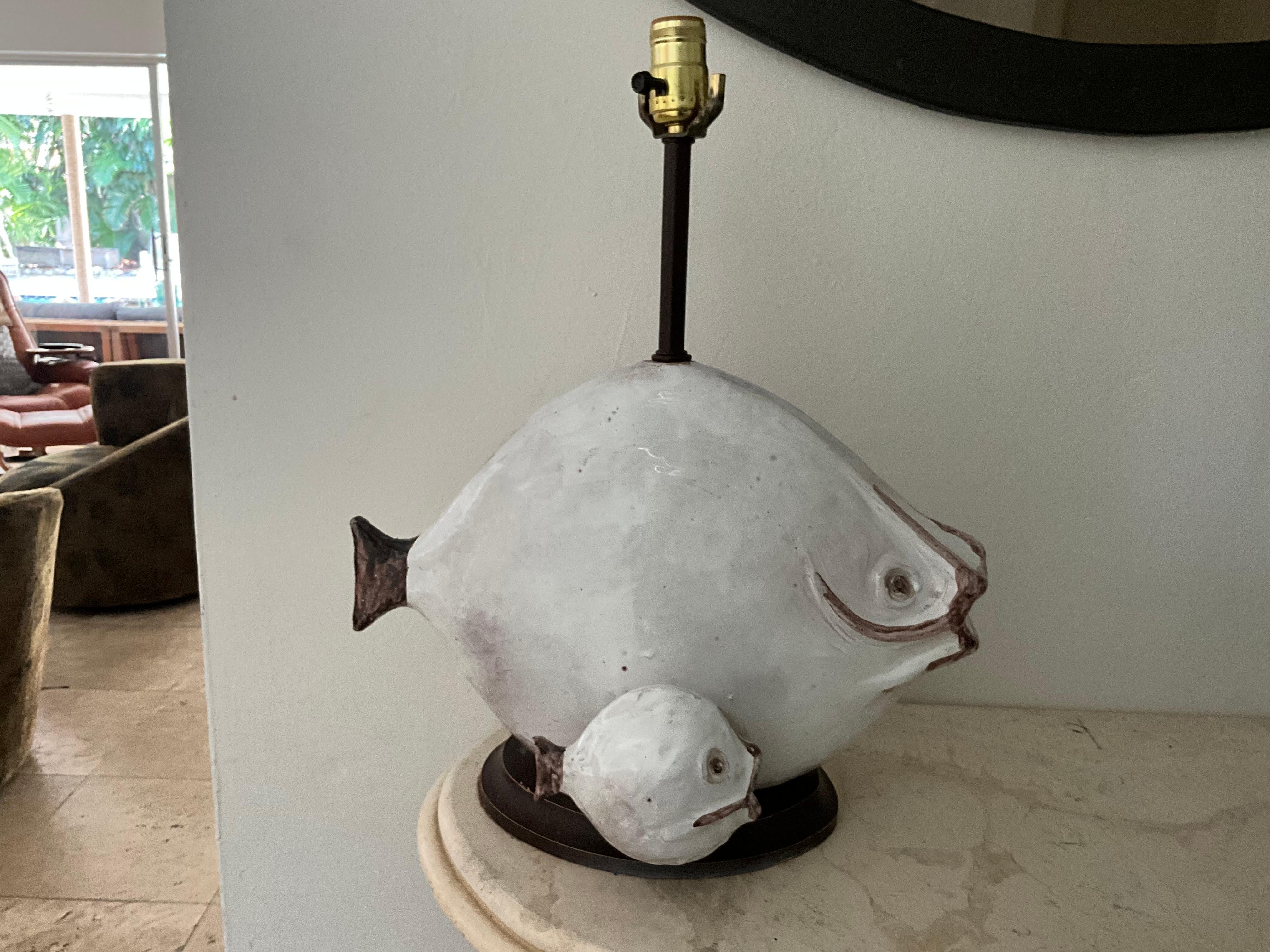 Ivo de Santos Ceramic Fish Lamp for Raymor - 1960s Studio Pottery

 This stunning ceramic fish lamp, designed by Ivo de Santos for Raymor, is a remarkable example of 1960s studio pottery. Measuring 16 inches wide, 19 inches in height, and 9 inches