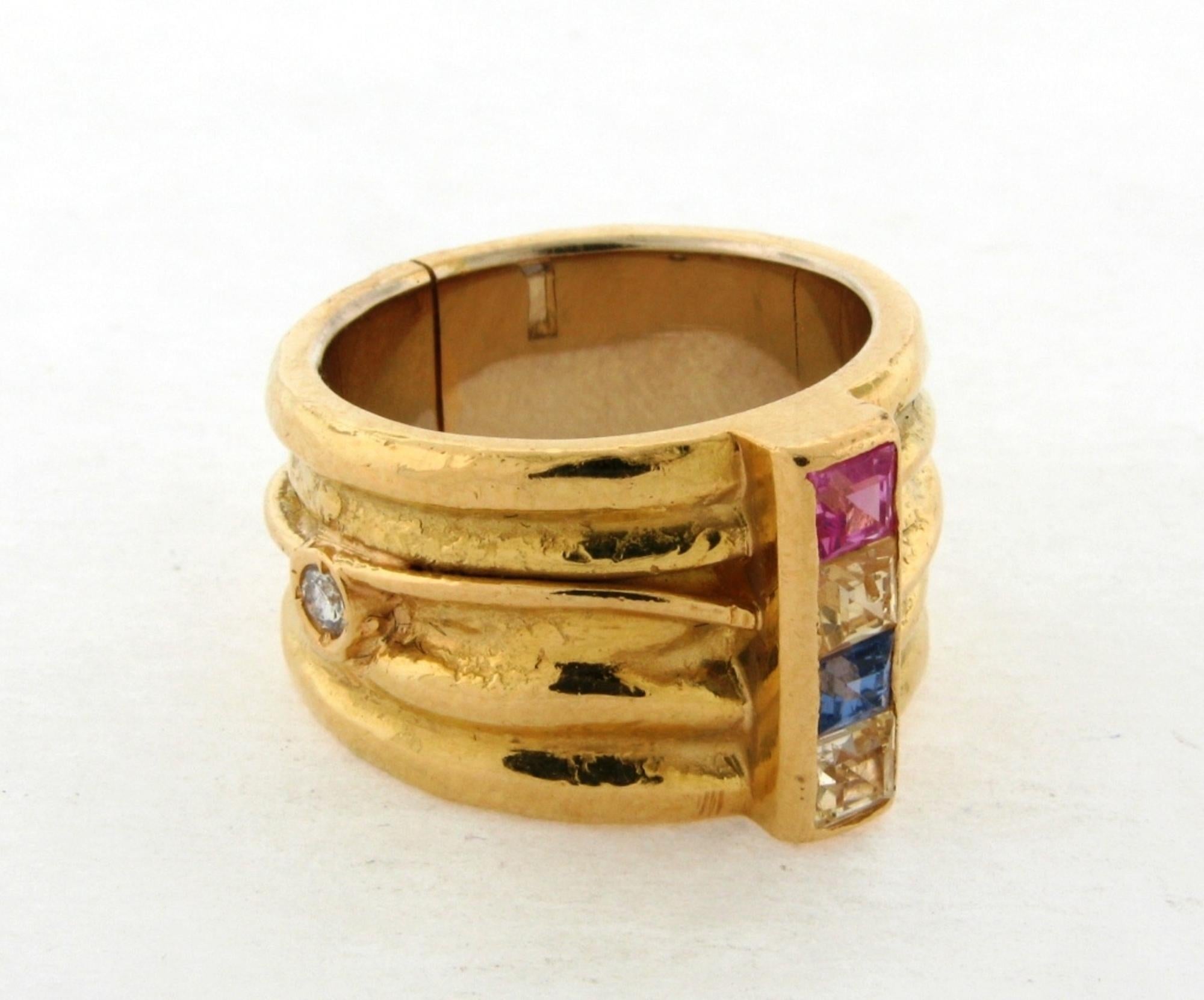 Stunning Ivo Misani Milan Designer Sapphire Diamond 18K Yellow Gold Ring. This is a beautiful and rare ring by an important Milan designer Ivo Misani. The ring is set with 4 emerald cut sapphires, white blue, yellow, and pink and a diamond on the