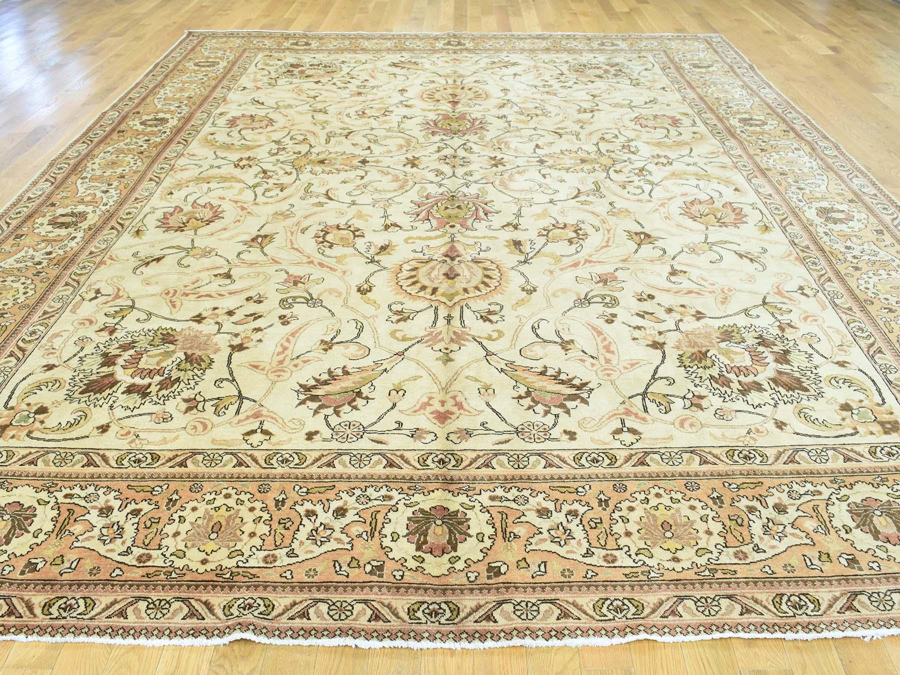This is a genuine hand knotted Oriental rug. It is not hand tufted or machine made rug. Our entire inventory is made of either hand knotted or handwoven rugs.

Start a new room with this superb antique carpet. This handcrafted Persian Tabriz hand