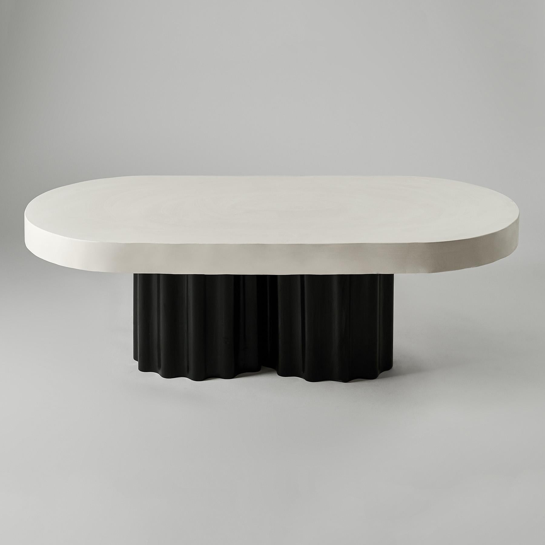 Ivory And Black Oval Coffee Table by Perler
Dimensions: D 58 x W 120 x H 60 cm.
Materials: Jesmonite.
Weight: 45 kg.

Dimensions may vary. Please contact us.

The Ivory&Black oval coffee table, standing on a wavy black leg, measures 120 cm in length