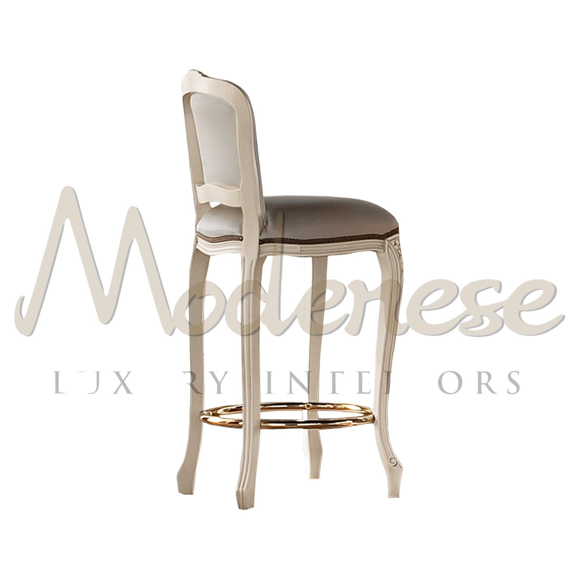 Lavish neoclassical bar stool in bright ivory finish and antiqued polishing with grey fabric upholstery both in the seating and in the backrest, featuring a golden metal round frame. This seating element, which goes best with the Modenese Home Bar