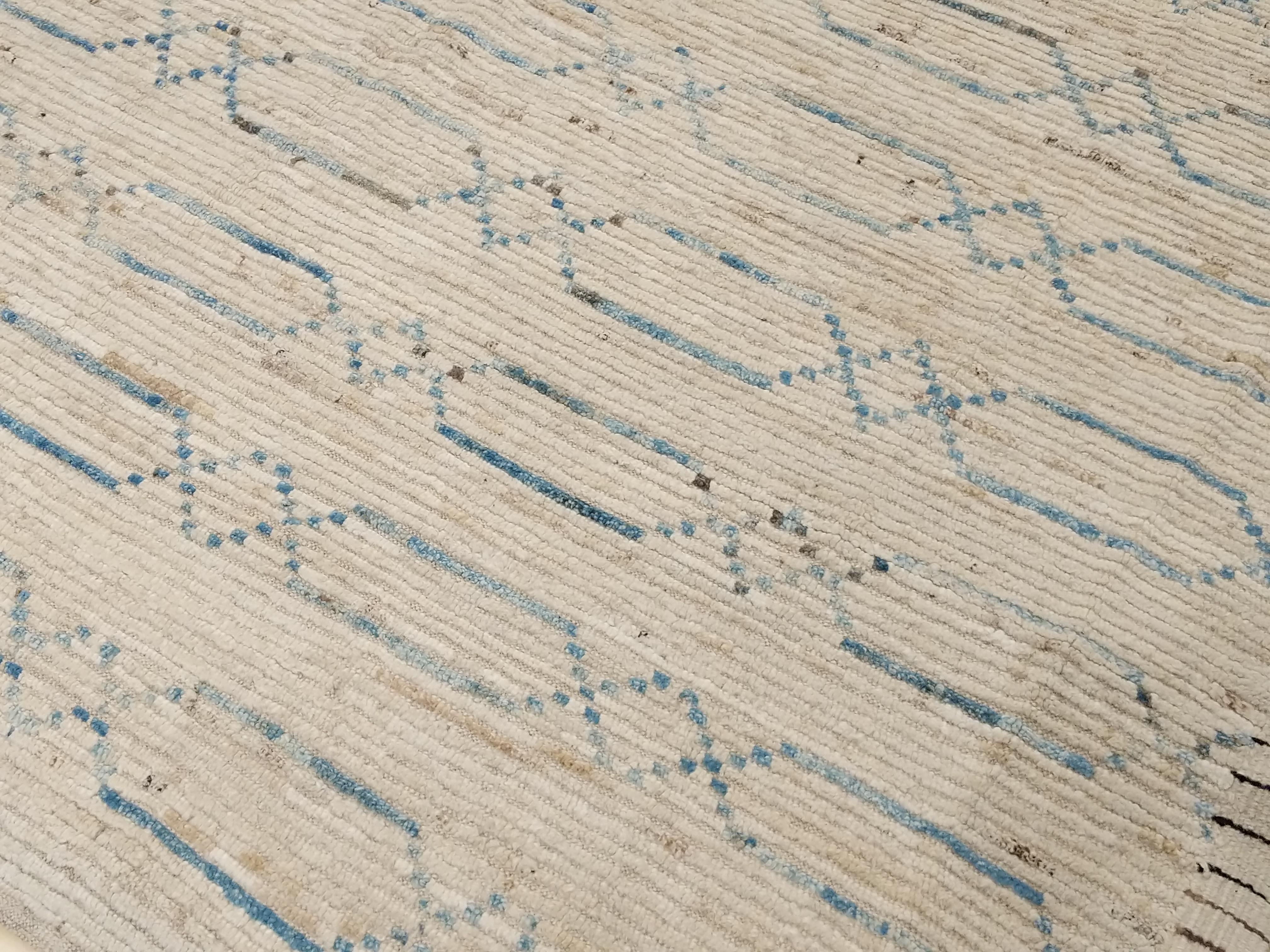 This exceptional contemporary carpet represents perfectly the direction I have been aiming at during the last few years, that is to design a collection of rugs which would embody the interesting textures of vintage Moroccan weavings together with