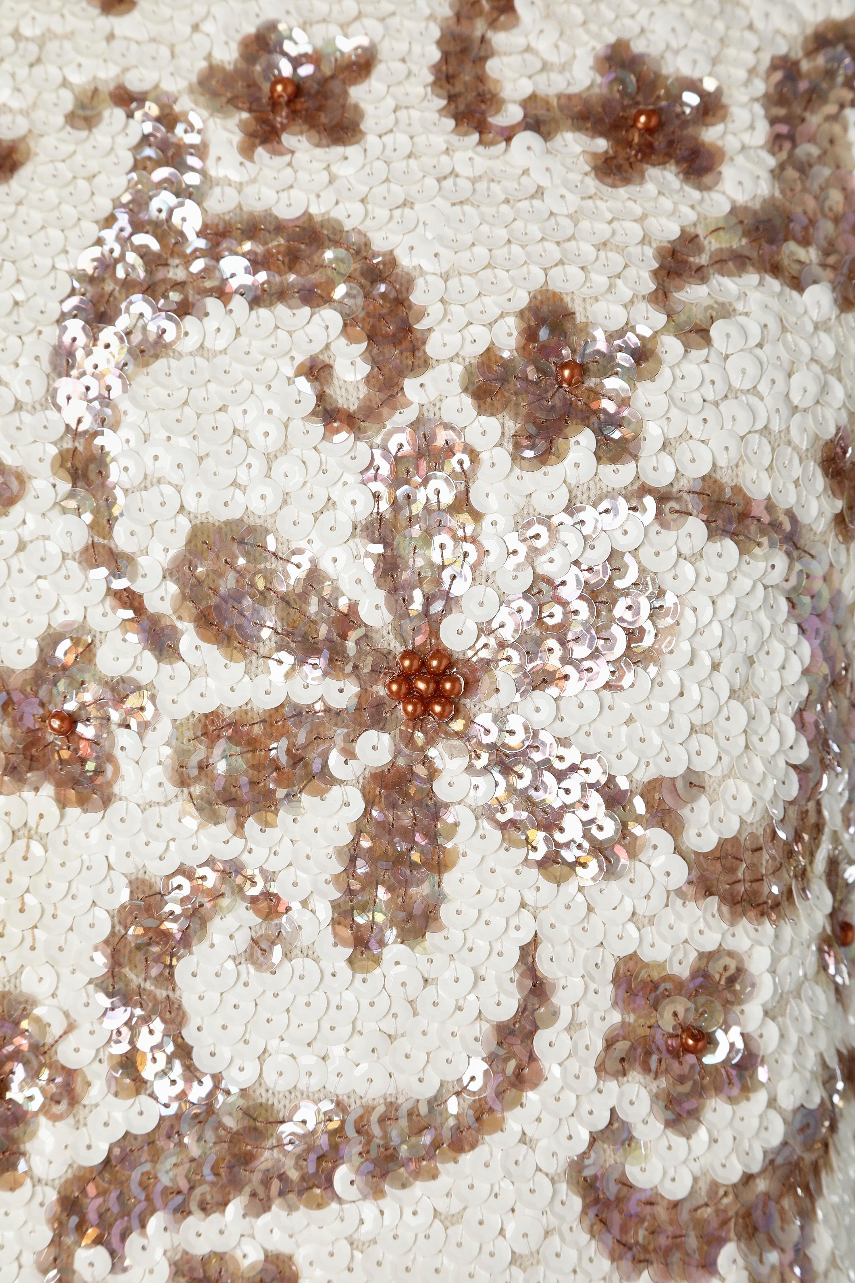 Ivory and light brown sequin sleeveless top on a wool knit base + beadwork.
 Rayon or acetate lining. Zip closure middle back. 
SIZE S on tag but fit M 