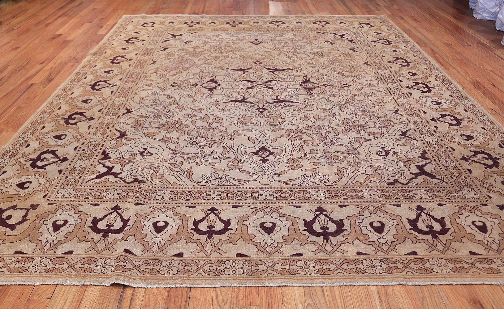 Antique Indian Amritsar rug, country of origin: India, circa 1920. Size: 9 ft 7 in x 11 ft 6 in (2.92 m x 3.51 m) 

Like many other beautiful antique Indian Amritsar rugs, this one uses simple colors in a contrasting palette to convey more