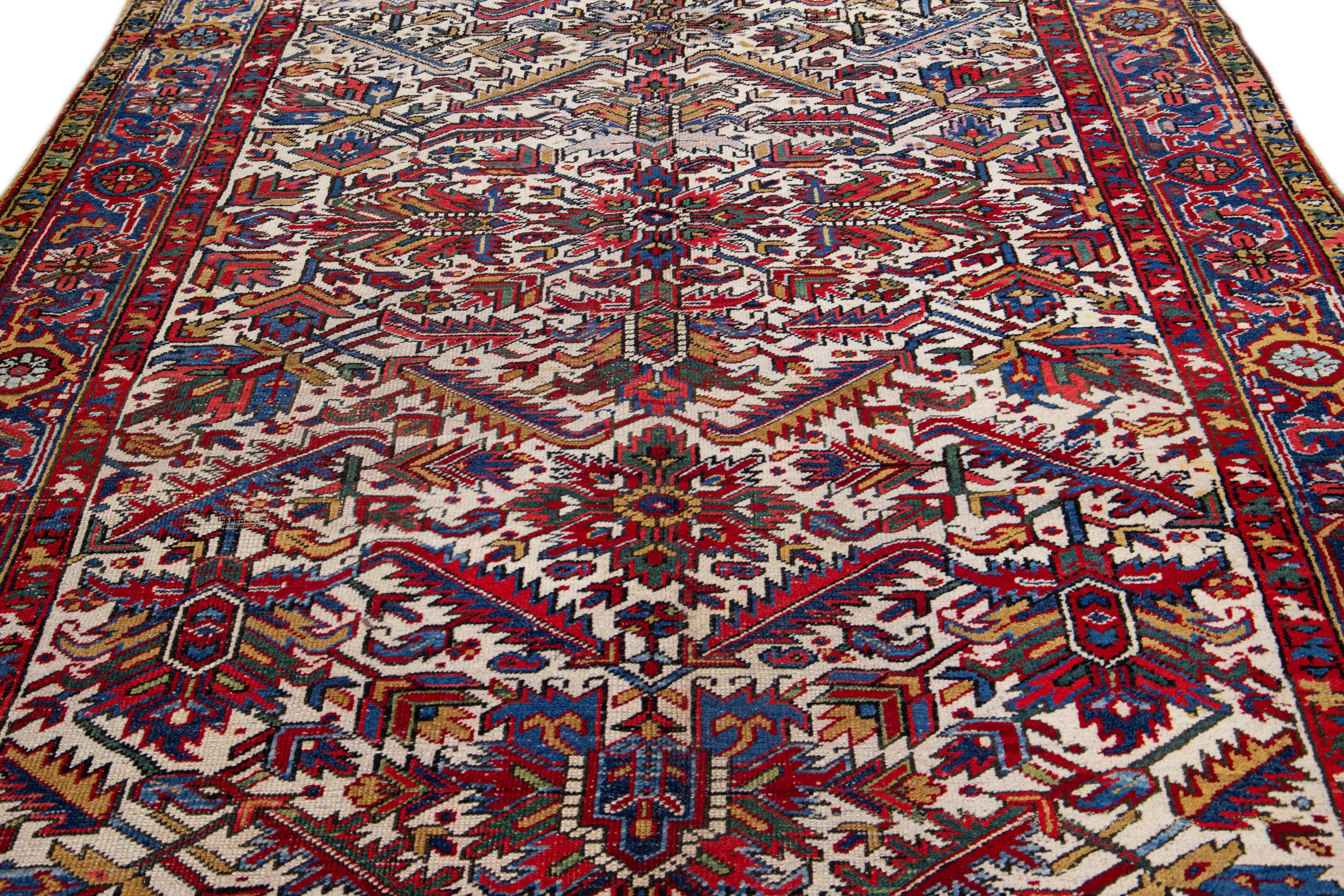Heriz Serapi Ivory Antique Persian Heriz Handmade Allover Floral Wool Rug For Sale