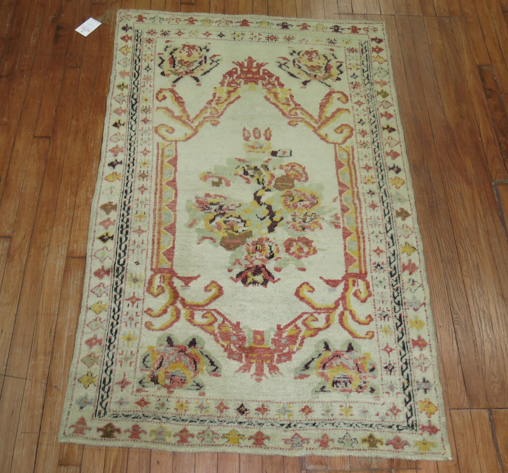 20th Century Zabihi Collection Ivory Antique Turkish Ghiordes Rug For Sale