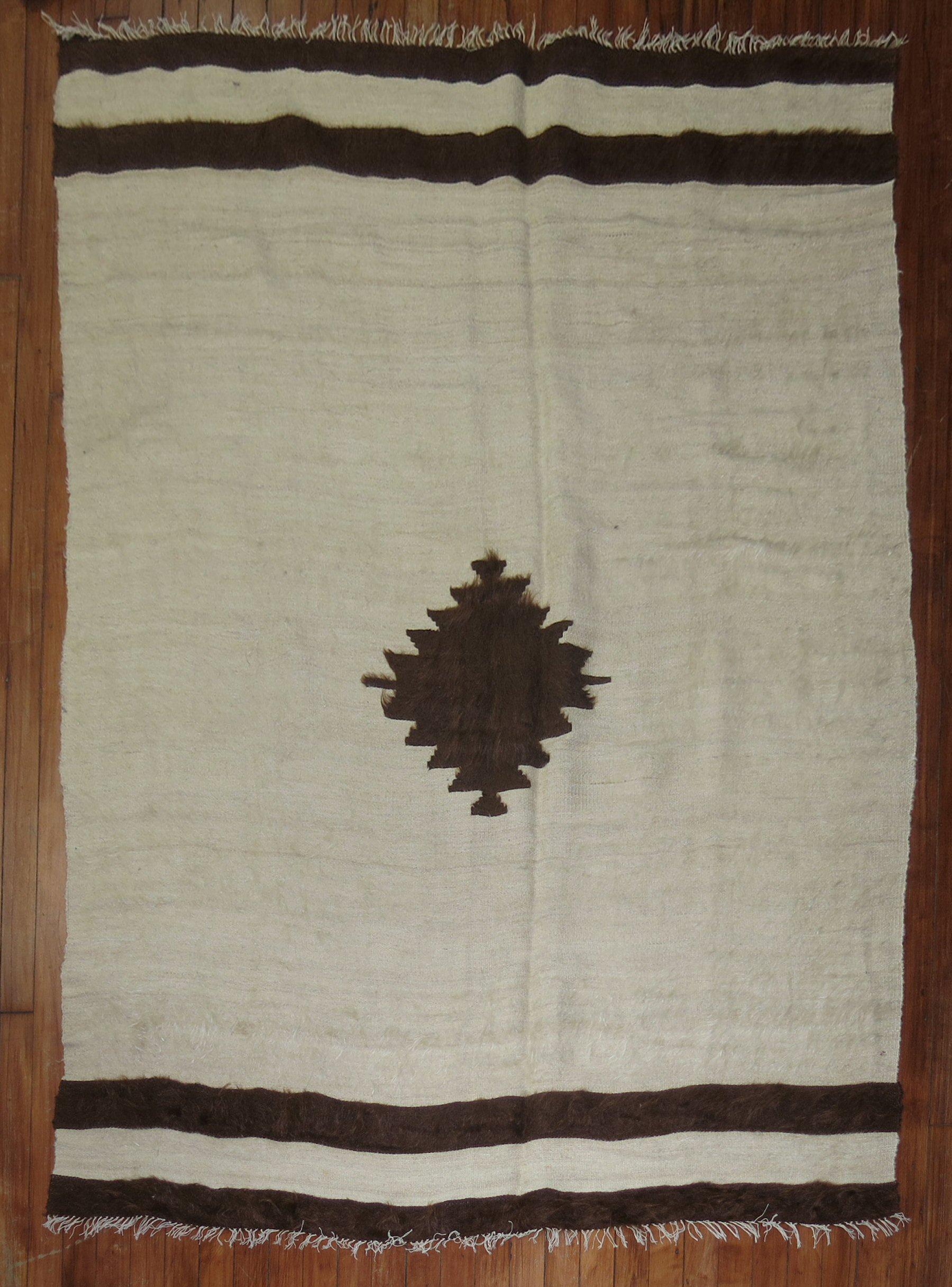 Vintage Angora mohair wool rug in brown and ivory.

Measures: 4'8'' x 6'.