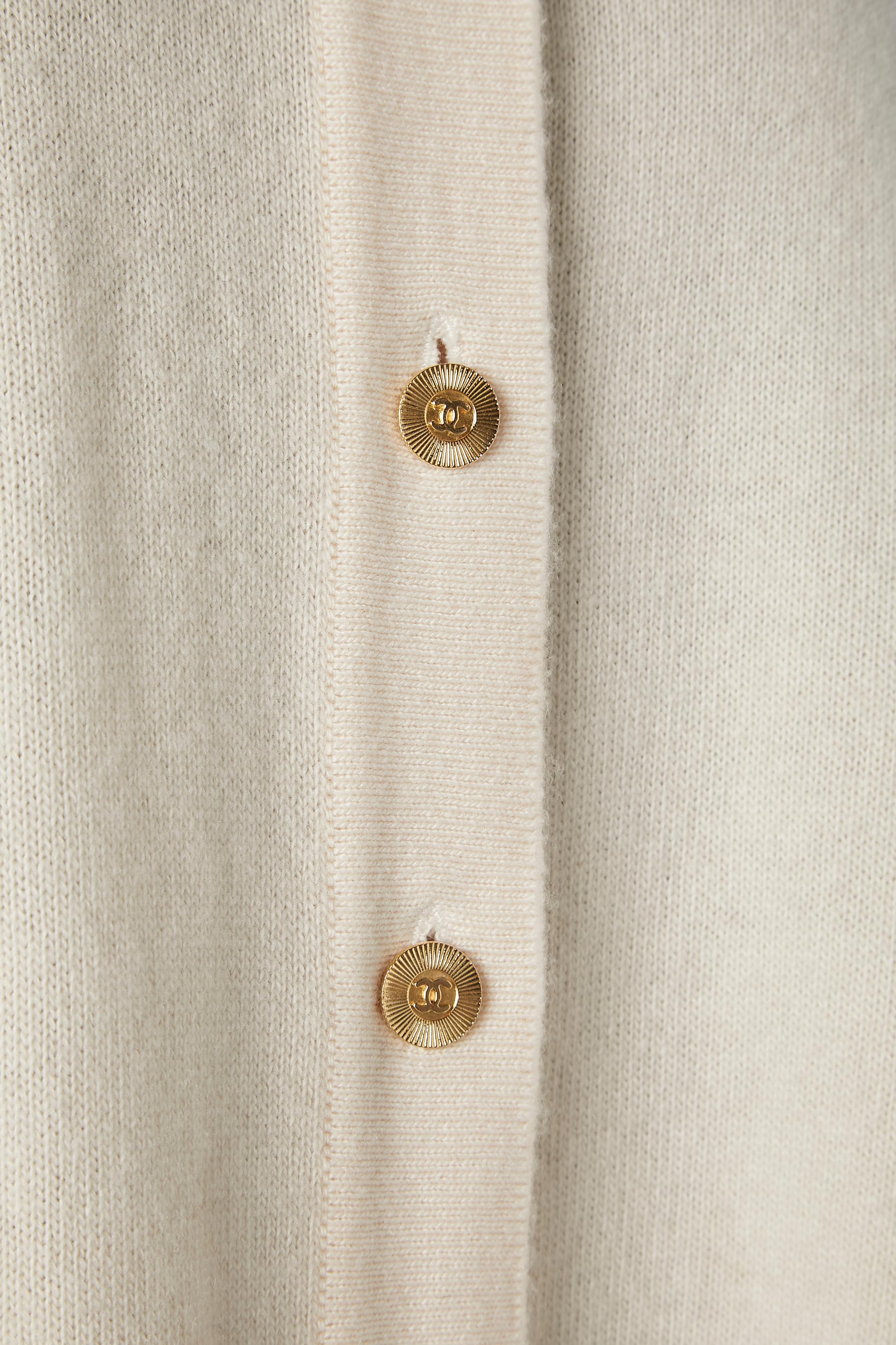 Gold Ivory cape-cardigan in cashmere with branded gold metal buttons Chanel 