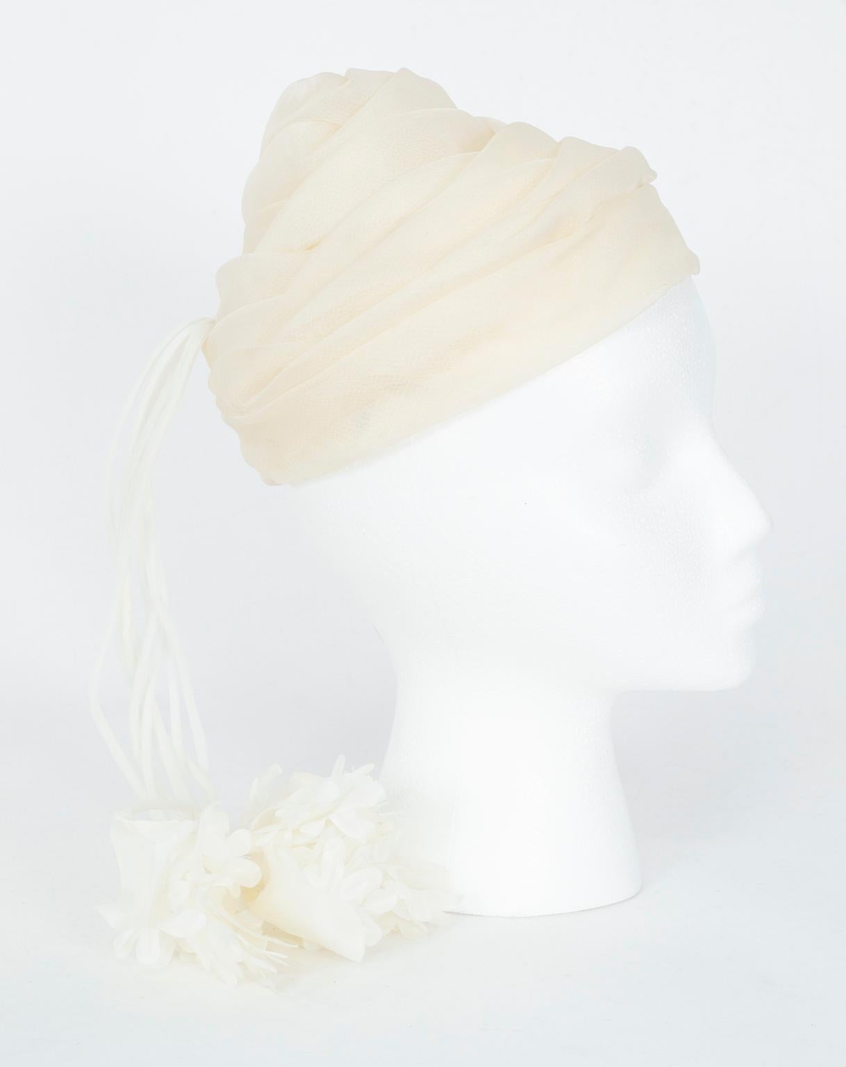 If a traditional wedding veil or cocktail hat is not your style, consider a floral calot: typically more couture in flavor, they remain ultra-feminine but leagues more stylish. Unlike most, however, this one combines high-style with handfuls of