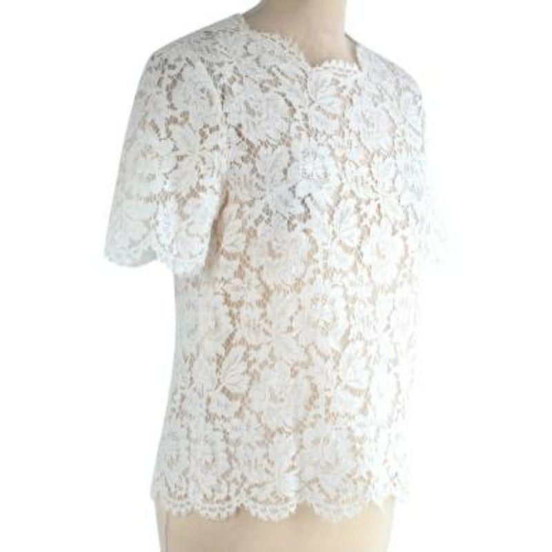 Valentino ivory corded lace shell top
 
 - Elegant, loosely tailored corded lace top
 - Round neck and short sleeves trimmed with delicate eyelash edging
 - Scalloped hemline 
 - Fully lined for modesty
 - Button at the nape 
 
 Materials:
 77%