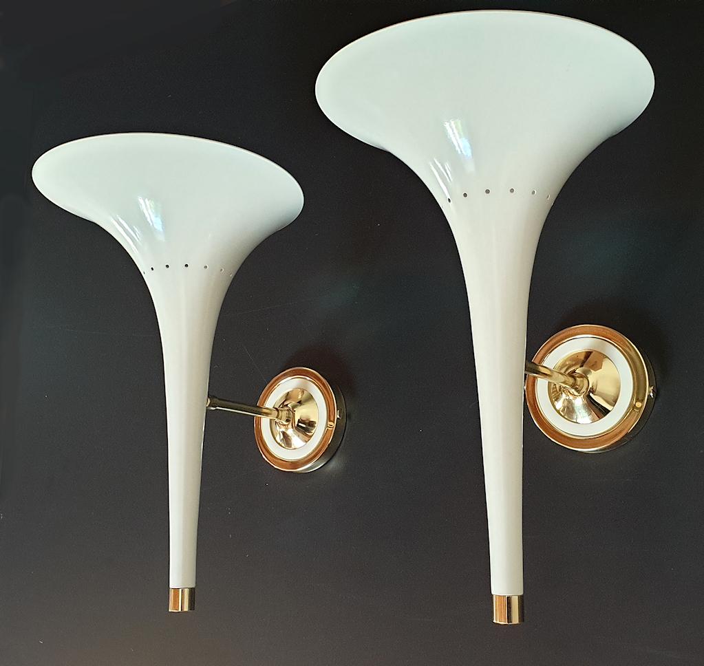 Pair of Mid-Century Modern sconces Stilnovo style, Italy, 1990s.
The ivory enamel and brass accent sconces have an elegant 