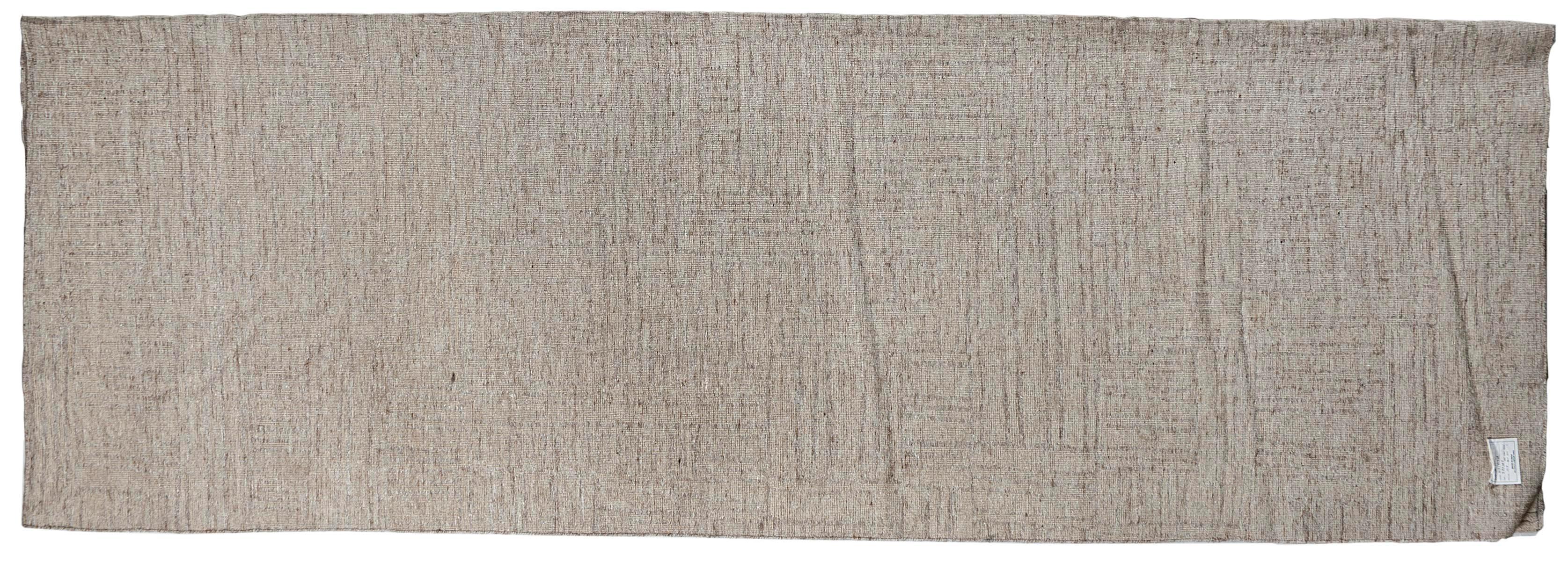 The creative use of cut and looped wool fibers gives this eye-catching area rug a distinct look and enticing feel. handmade in India using all natural materials and dyes.