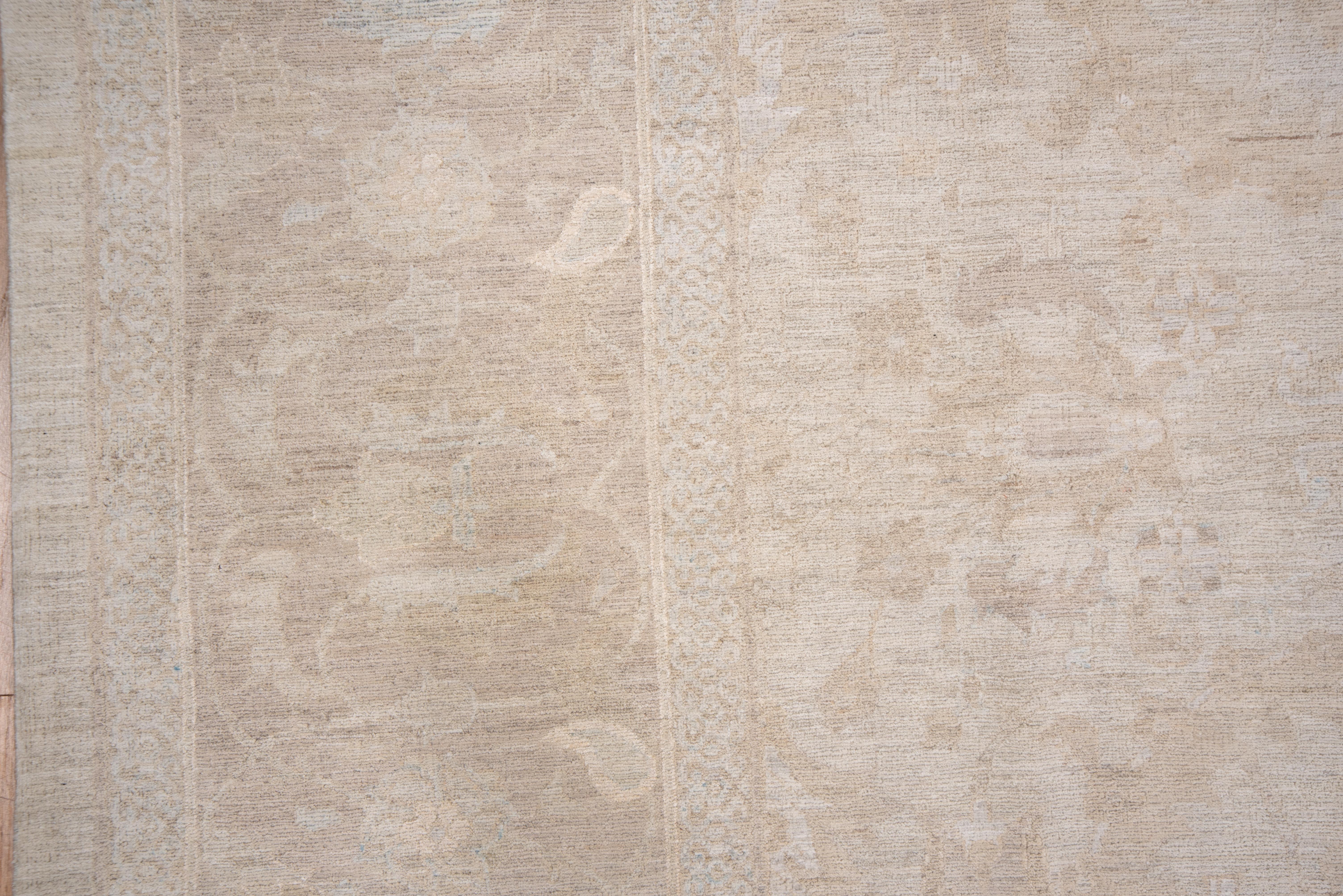 This as new condition, wool and silk contemporary carpet has a shadow design in tones of off white and pale tan of speckles, 