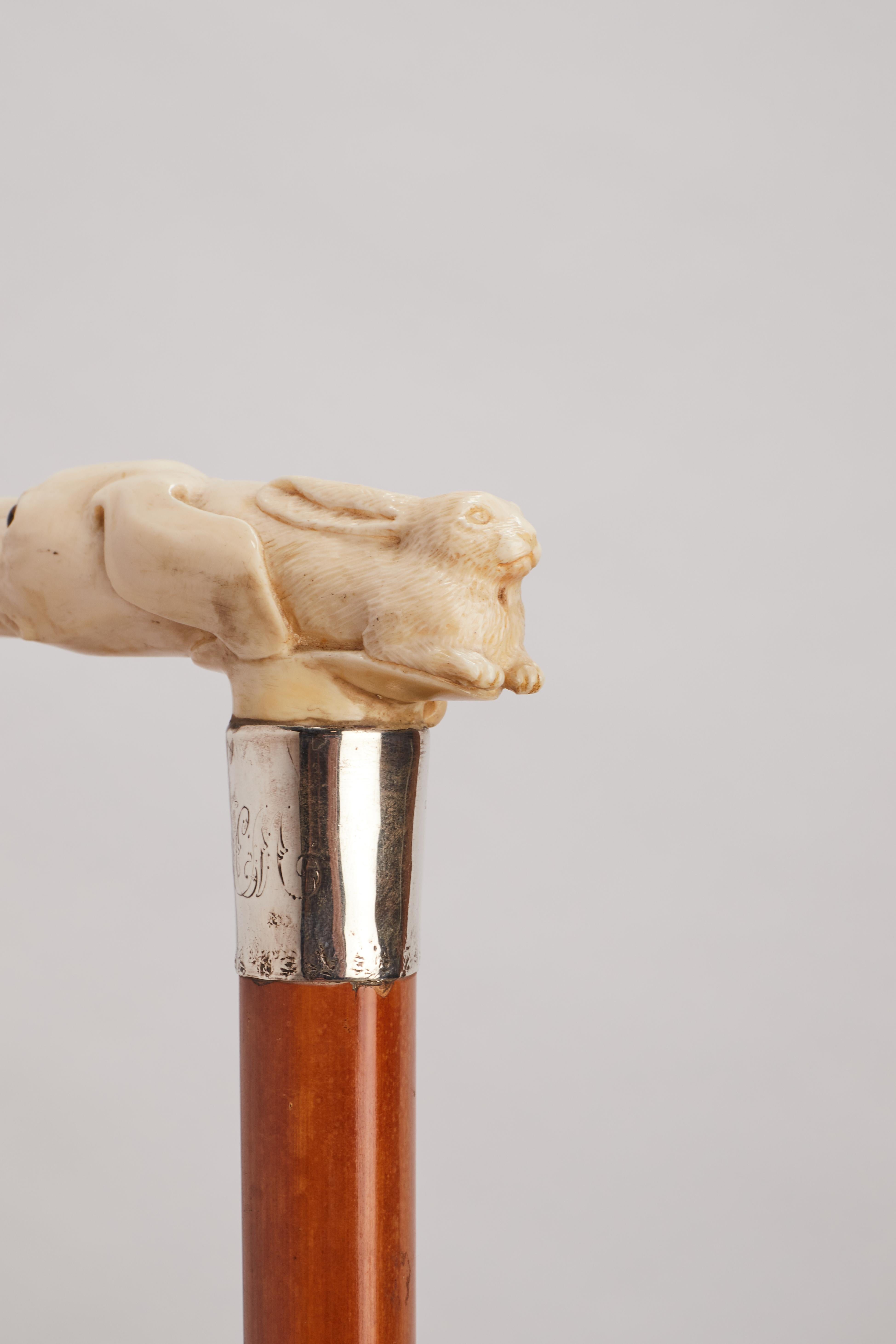 British Ivory handle walking stick depicting a dog and a hare, UK 1890.  For Sale