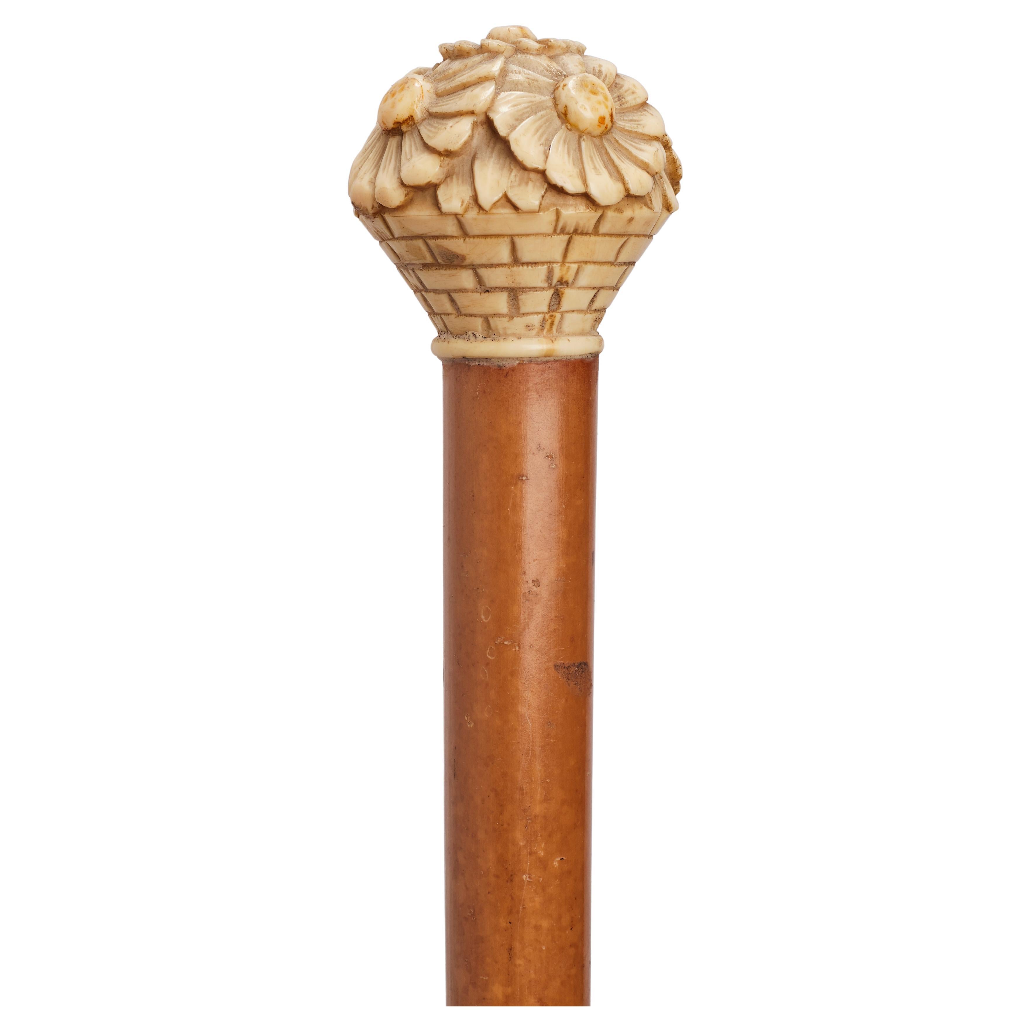 Ivory handle walking stick depicting a vase with daisies, France 1915.