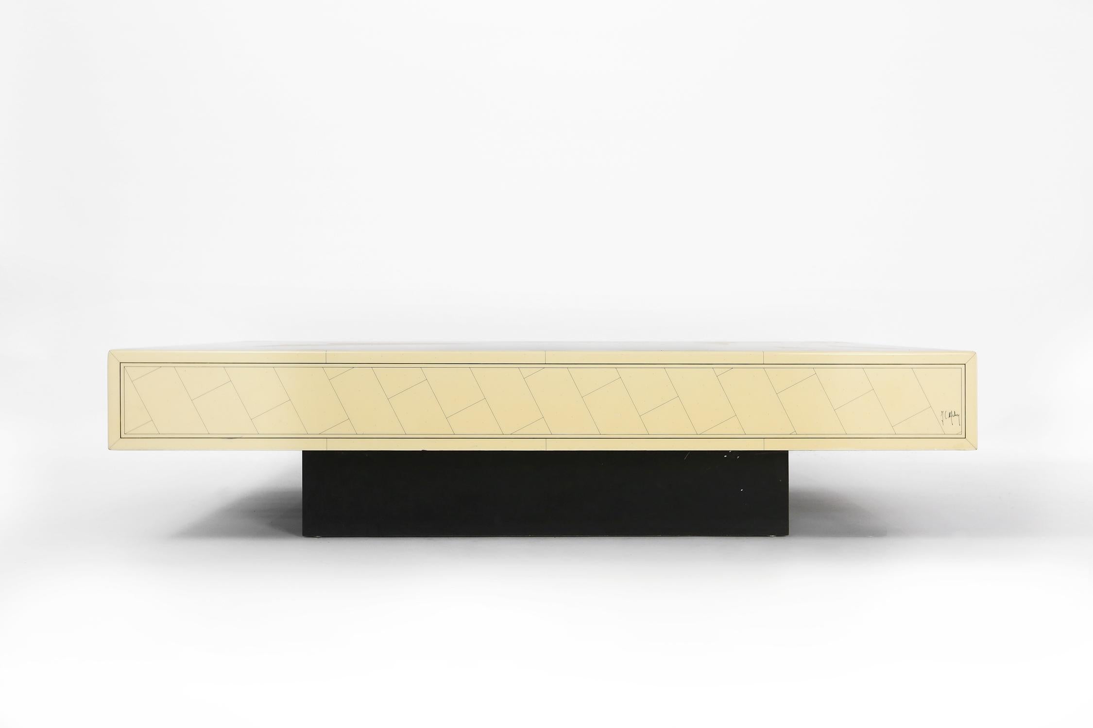 Minimalistic chic large coffee table designed by Jean Claude Mahey, France. A rare find in very good vintage condition. Manufactured in solid wood. Table surface lacquered in creamy white ivory with a luxurious geometric pattern painted in black on