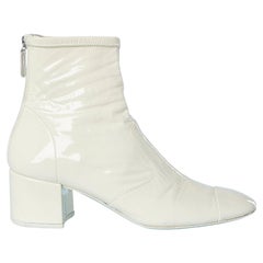 Ivory leather patent low boots with zip in the back Chanel 