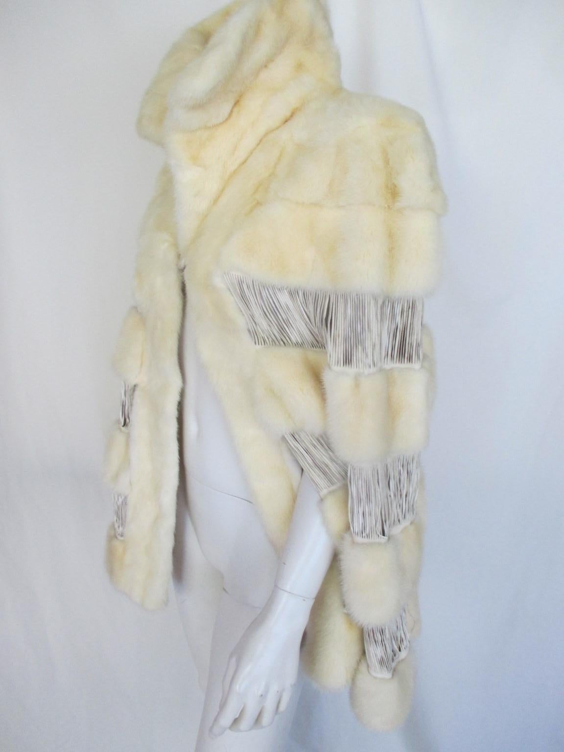 This rare vintage fur cape is made of soft mink with leather closed fringes

We offer more exclusive fur items, view our frontstore

Details:
1 closing button
2 open splits for hands
Light weight
Soft and supple
Furrier: Toschi, Italy
One