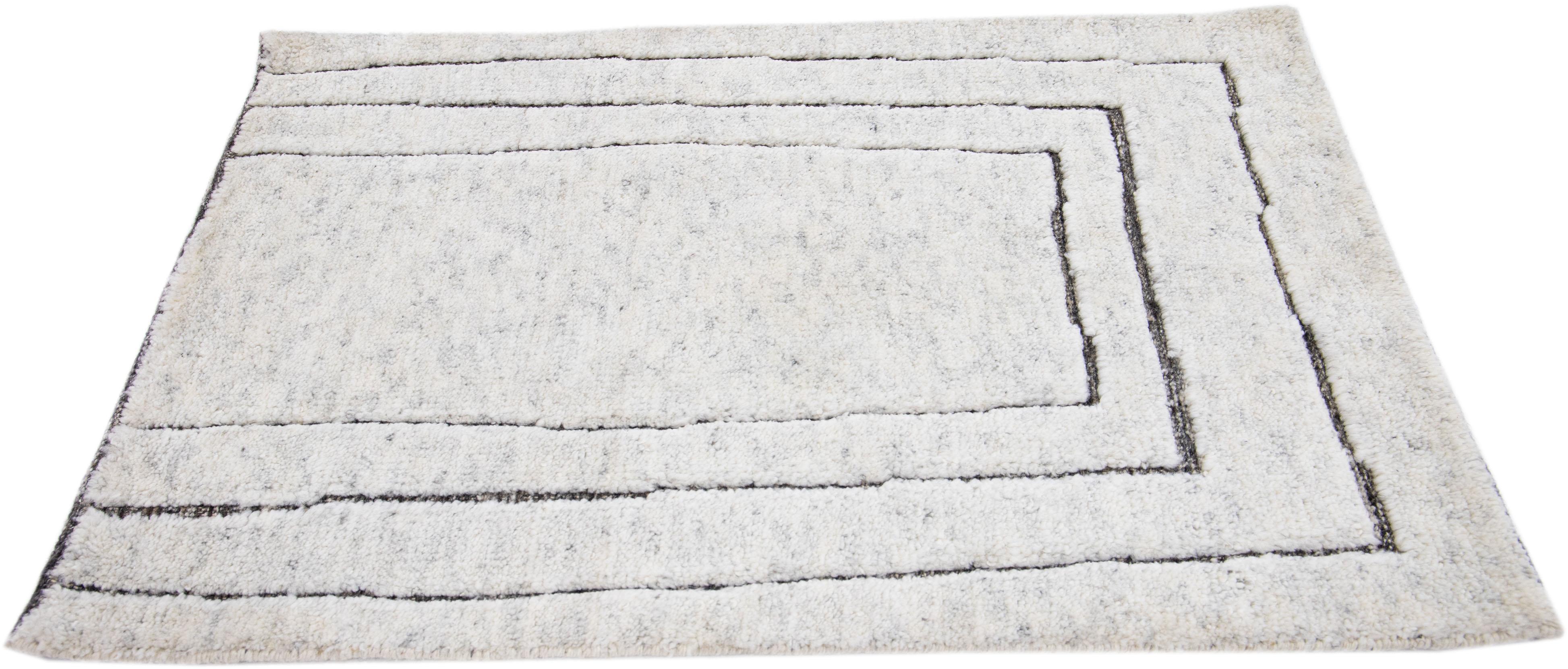 Apadana's Modern Moroccan Style wool custom rug. Custom sizes and colors made-to-order.

Material: 80 Wool and 20 Cotton.
Techniques: Hand-Loomed.
Style: Moroccan.
Lead time: Approx. 15-16 weeks available.
Colors: As shown, other custom colors are