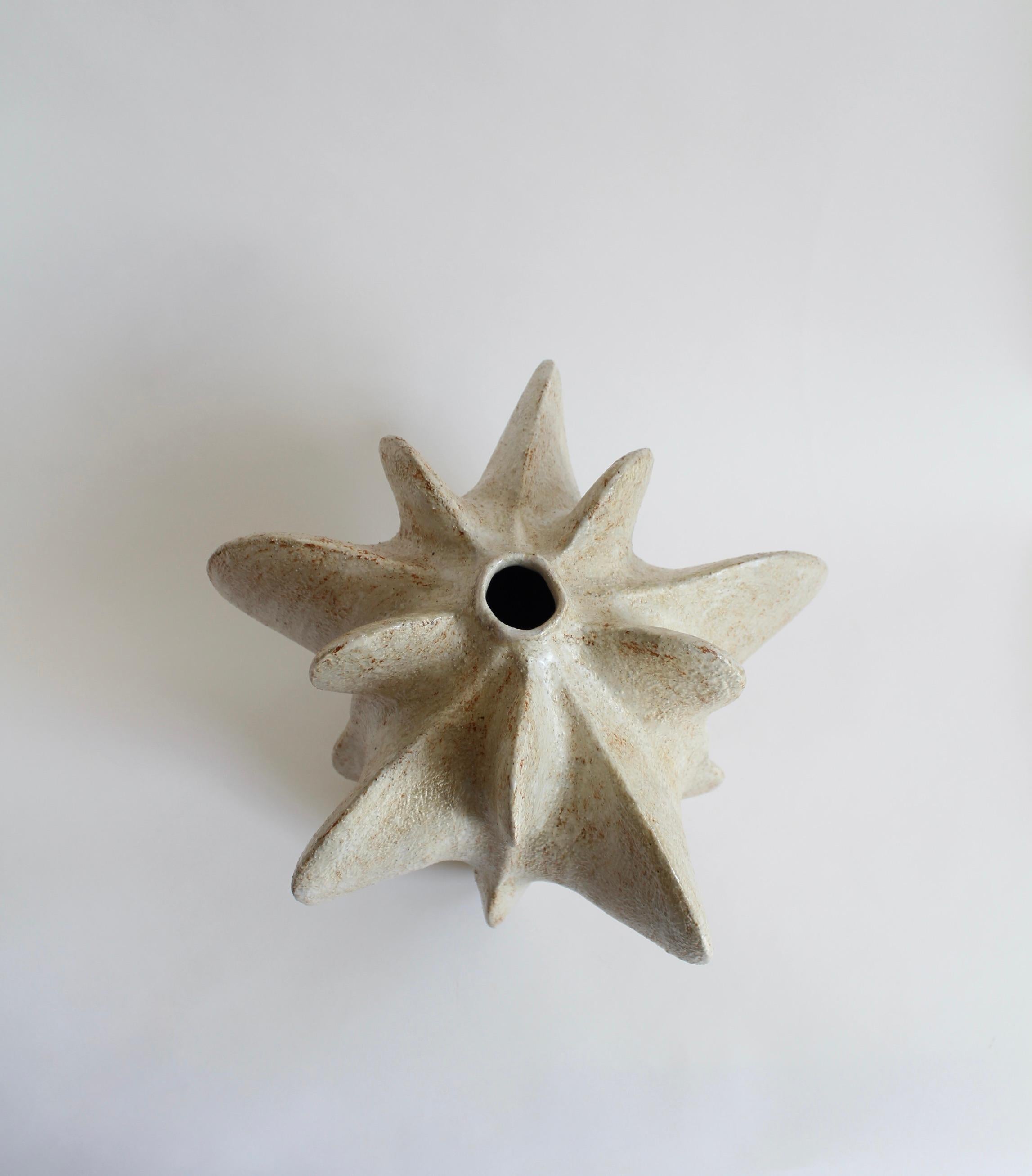 Ivory Petal Gourd IV by Julie Nelson
One Of A Kind
Dimensions: D 34 x H 32 cm
Materials: Ceramic stoneware and porcelain

Artist Julie Nelson uses the materiality of clay as a means to explore naturally occurring patterns and