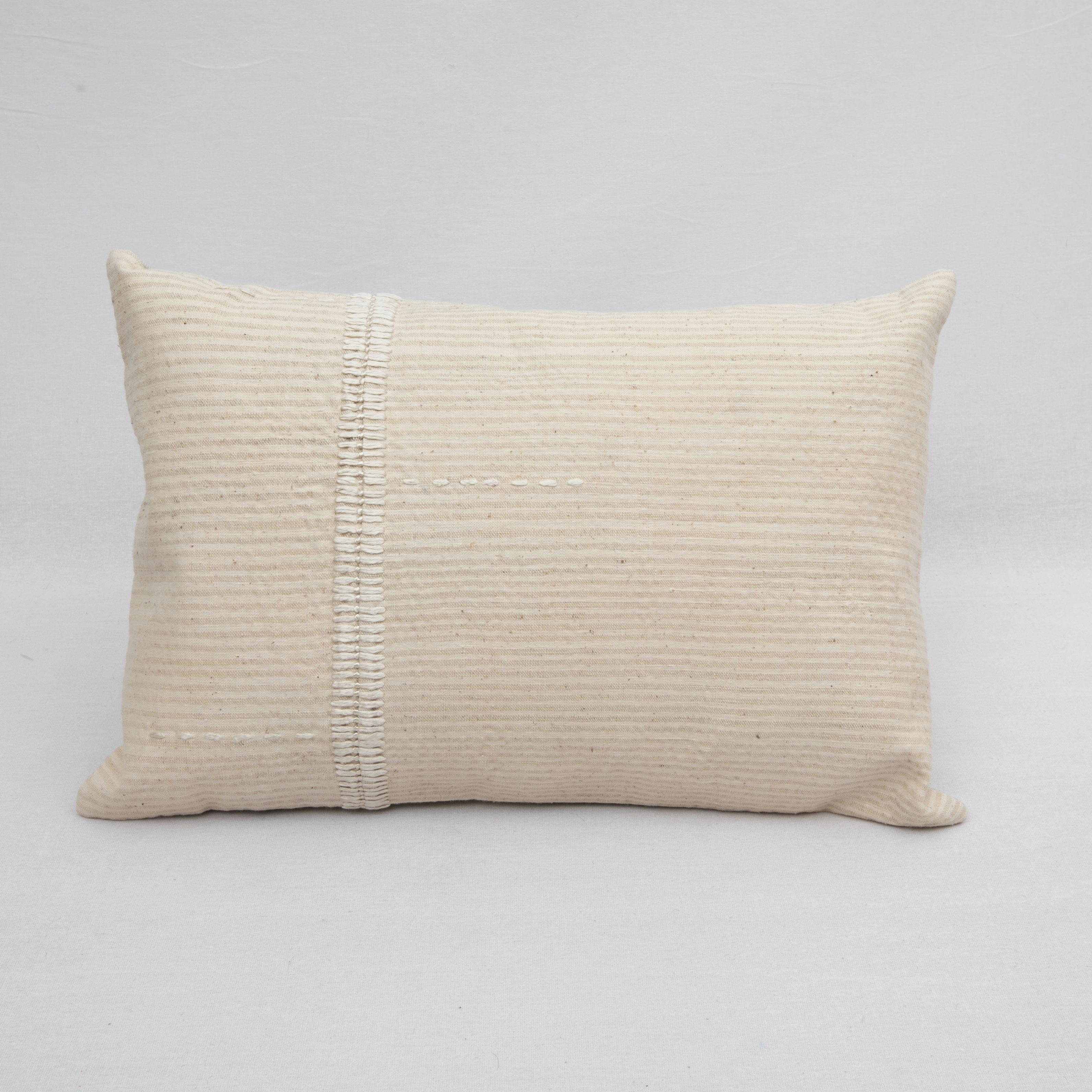 This Pillow Case id made from a vintage cotton and wool coverlet made during mid 20th c. in Western Anatolia, Turkey. The silk stitching on it is hand done by us.

It does not come with an insert.
Linen in the back.
Zipper Closure.
Dry Cleaning