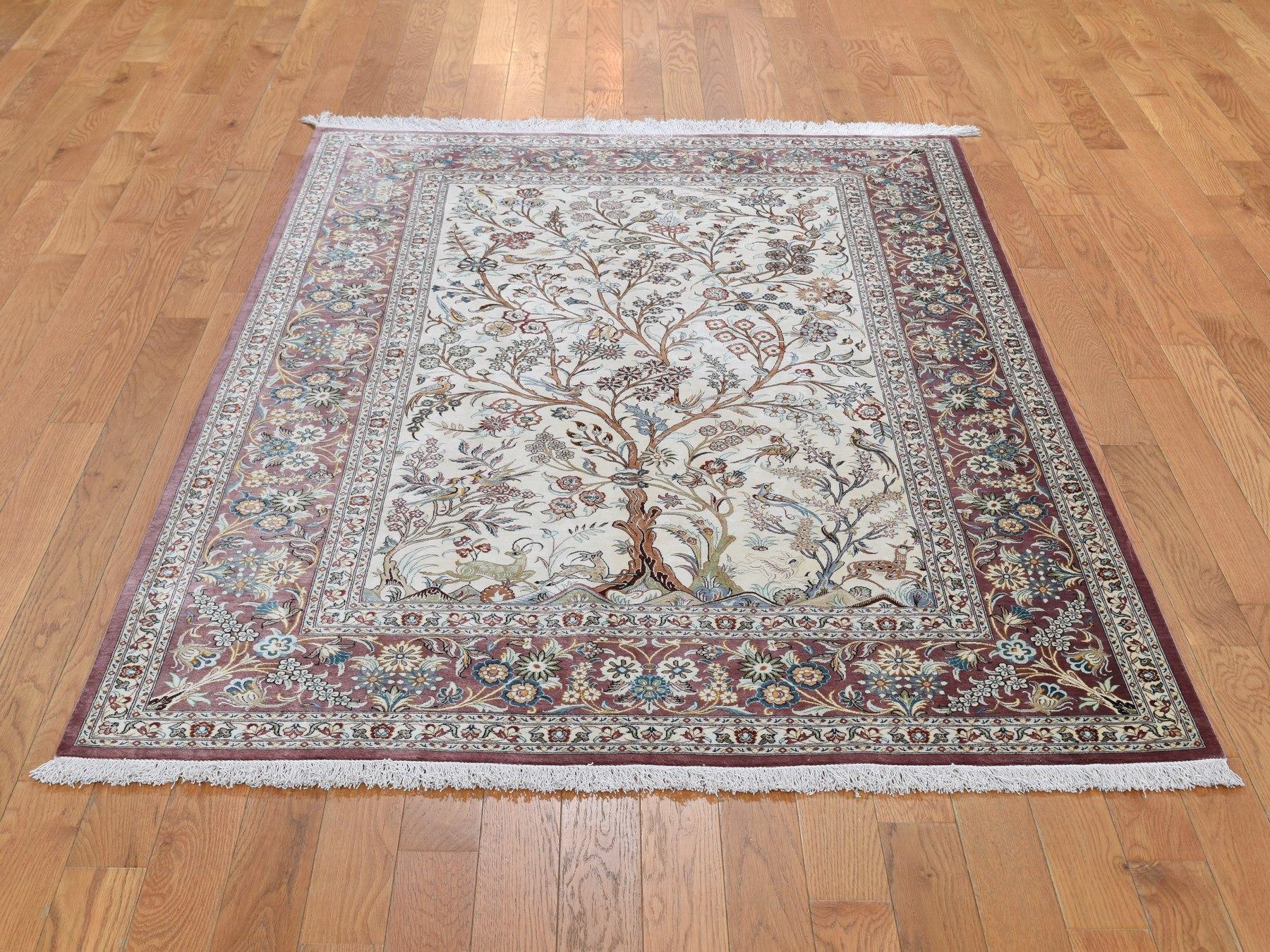 This is a truly genuine one-of-a-kind ivory pure silk Persian Qum signed 600 KPSI tree of life hand knotted rug. It has been knotted for months and months in the centuries-old Persian weaving craftsmanship techniques by expert artisans.

Primary