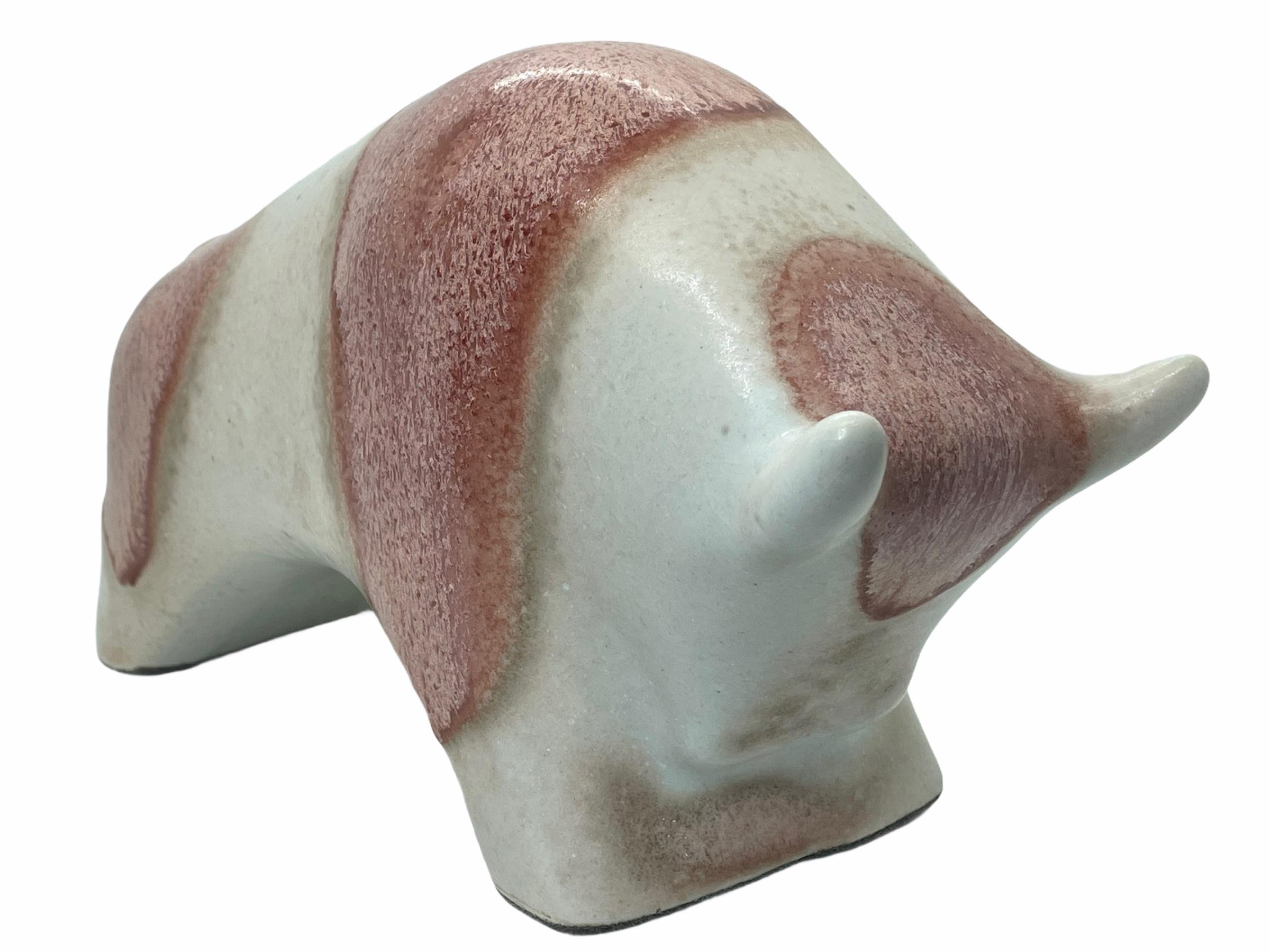 An amazing glazed ceramic Mid-Century Modern bull figurine statue, made in Germany, circa 1970s by Otto Keramik. Ivory and red colors. It is in very good condition with no chips, cracks, or flea bites.
