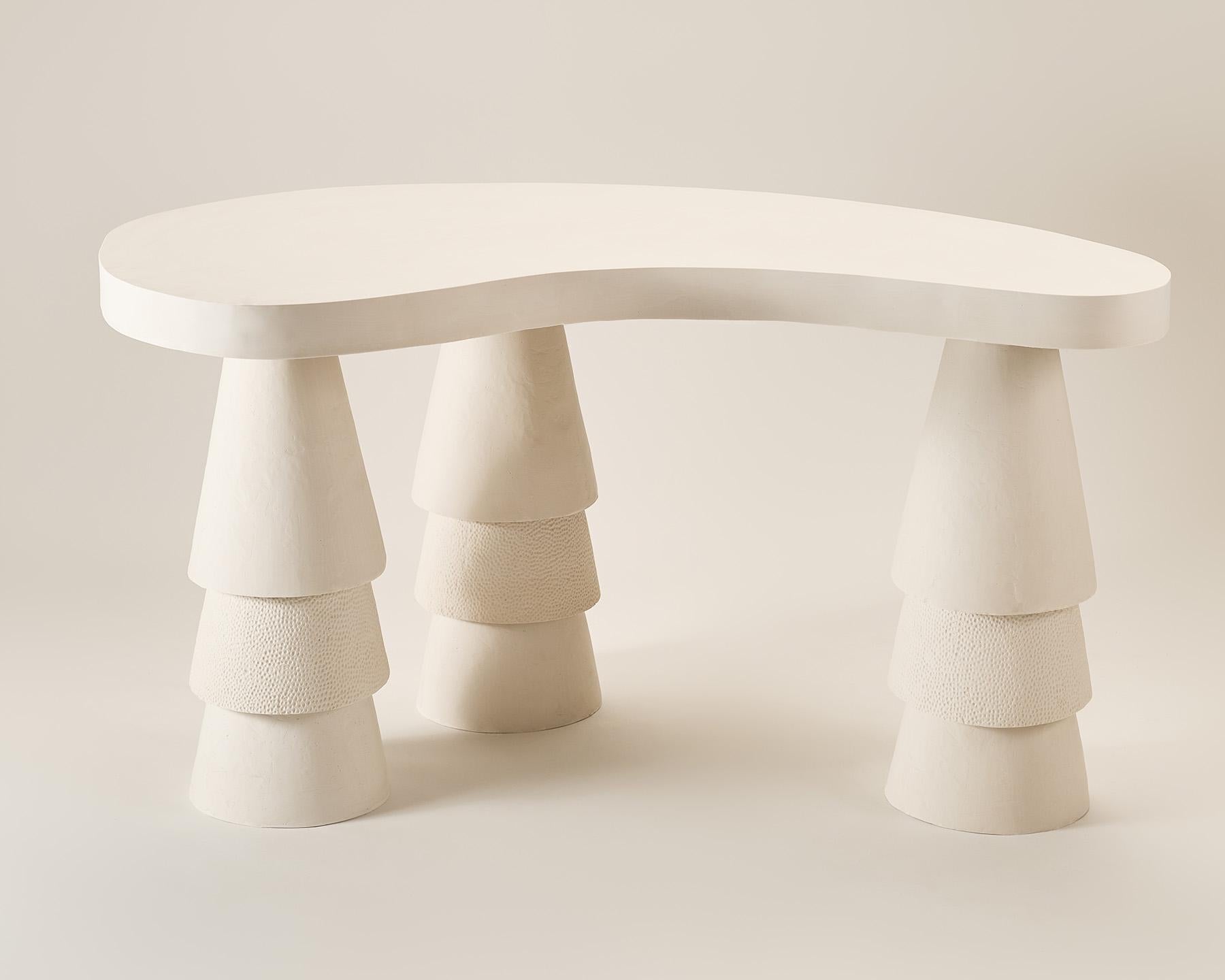 Ivory Ripple Desk by Perler
Limited Edition
Dimensions: W 130 x D 70 x H 75 cm. Tabletop thickness: 7 cm
Materials: Jesmonite.
Weight: 50 kg.
Color: A subtle shade of warm white/ivory
Finish: Matte

Texture: Smooth to the touch on the Tabletop; the