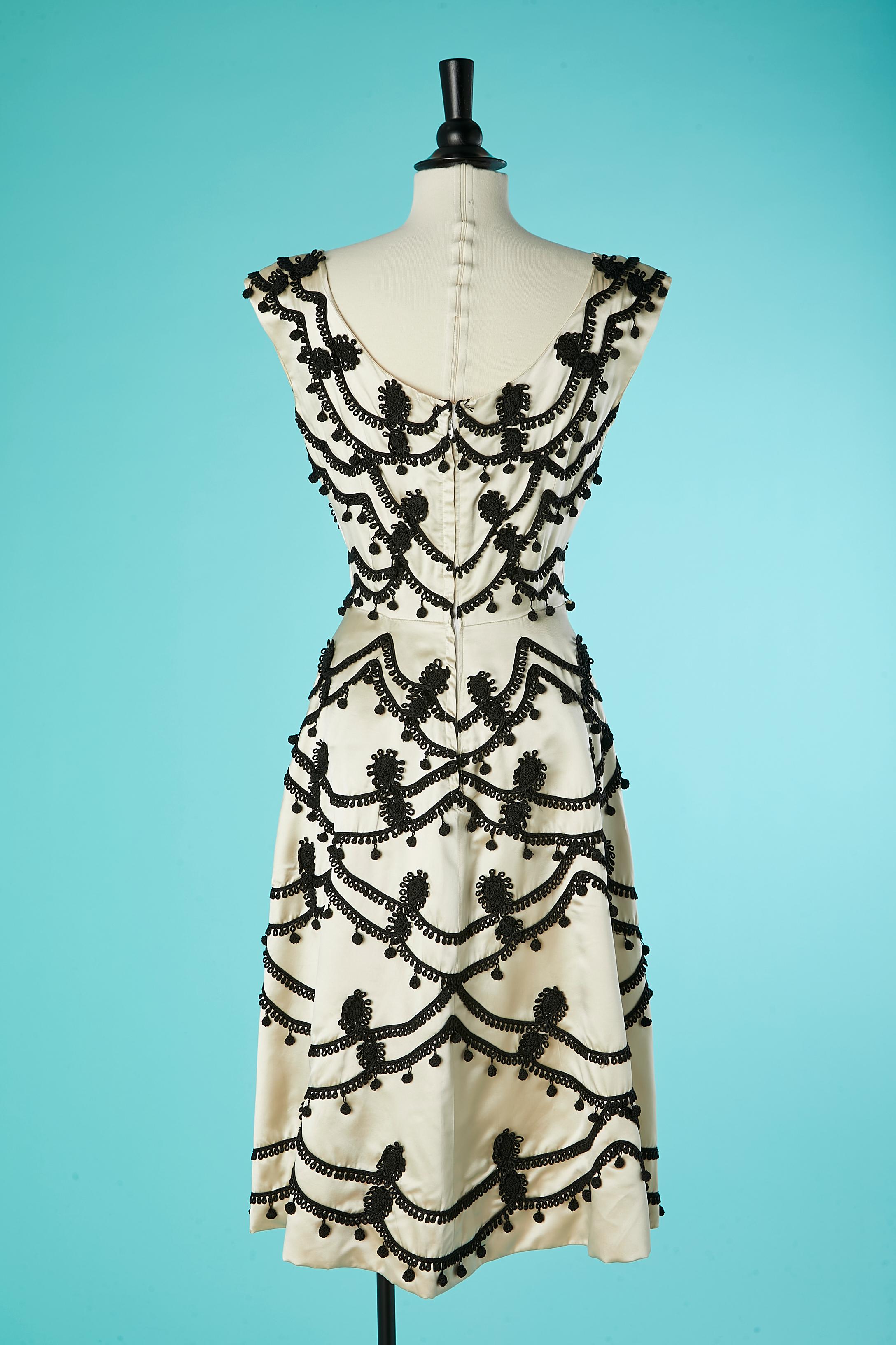 Ivory satin cocktail dress with black passementerie embellishment Circa 1950 For Sale 1