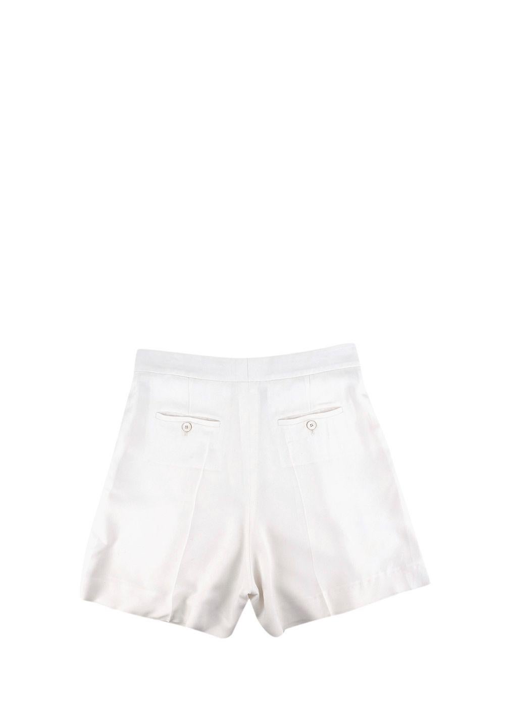 Chloe Ivory Silk Twill Tailored Shorts

- High waisted
- Lightweight silk twill 
- Slip side pockets 
- Two back pockets with button fastening 
- Zip fly with hook and bar fastenings 
- Silk lined

Material: 
Shell:
53% Acetate
47% Viscose
Lining: