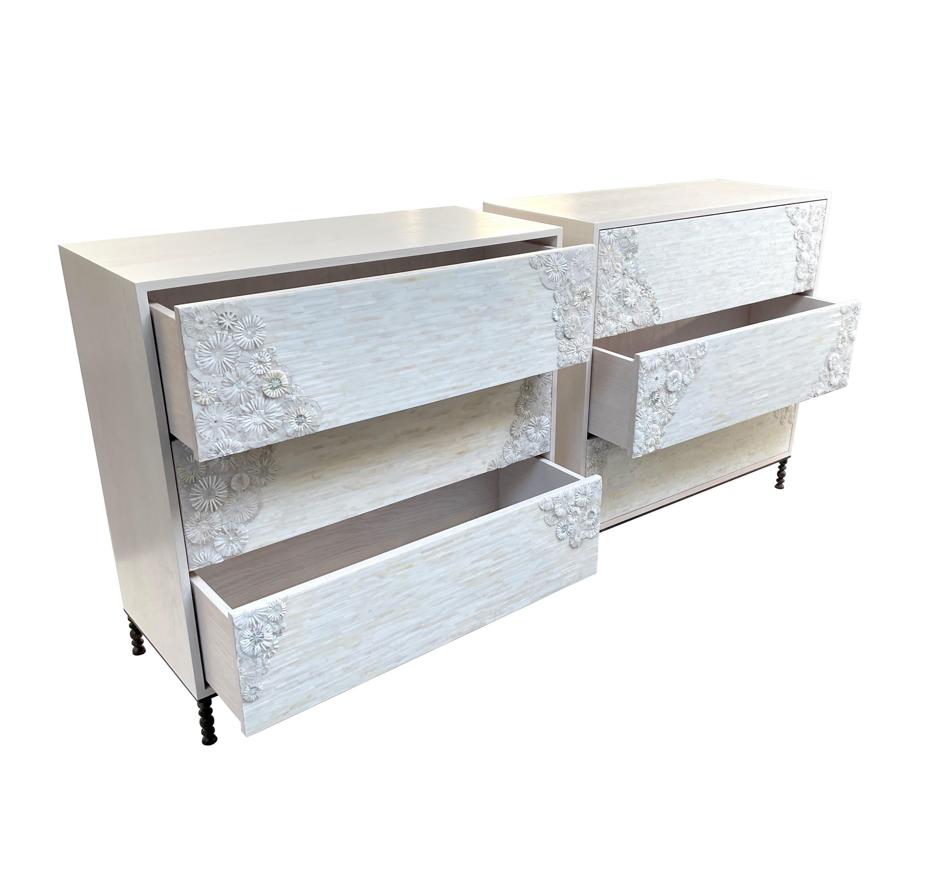 Ivory chest of 3 drawers made by Ercole Home in Brooklyn. 
The wood case is an ivory wash finish on oak, and the front has 3 touch latch drawers.
The drawers are covered with hand cut blossom pattern glass mosaic in a mix of whites and ivory