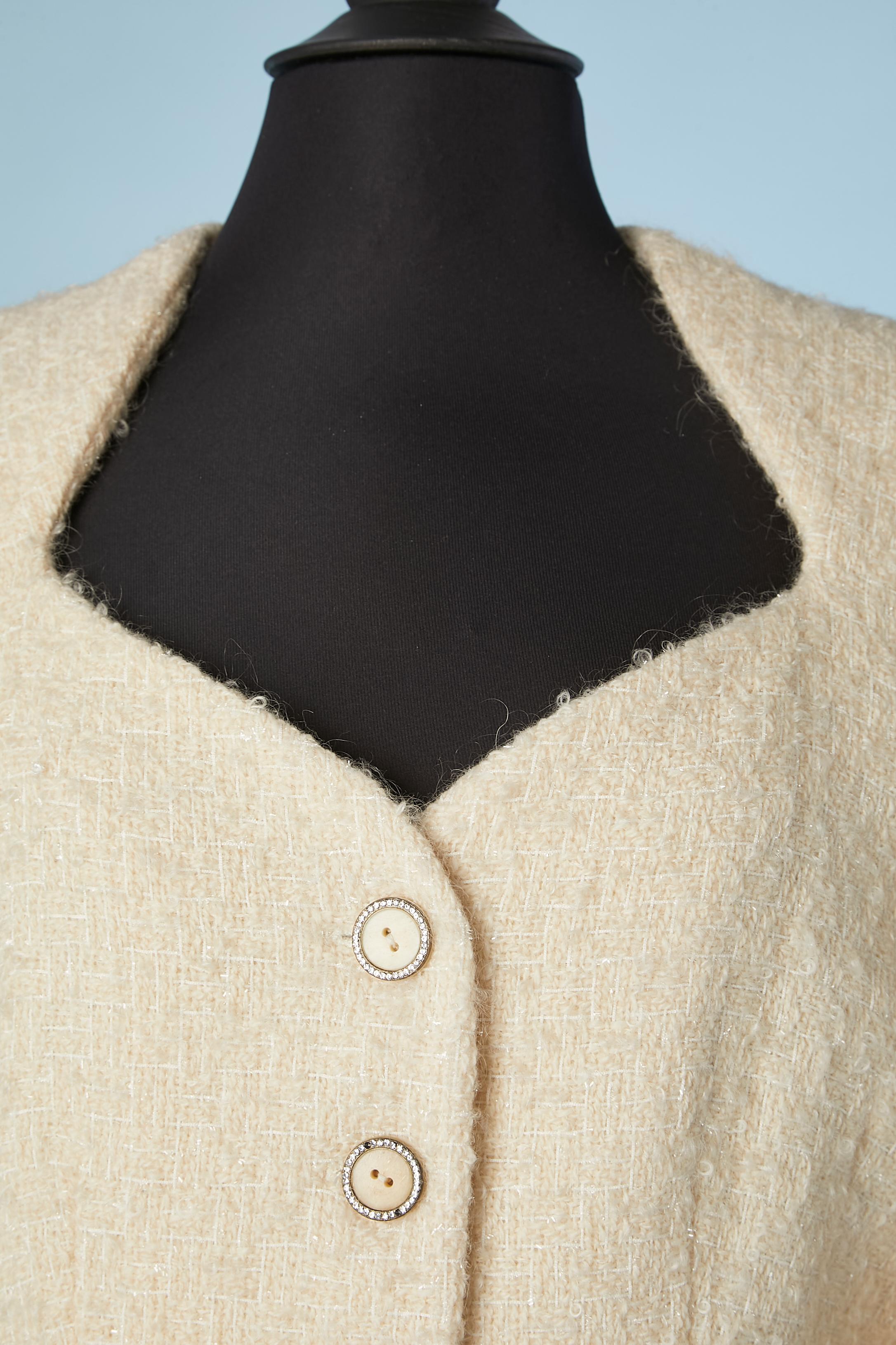 Ivory tweed bouclette wool single breasted evening jacket with rhinestone button. Silk lining. 
SIZE 42(Fr) 12 (Us) 