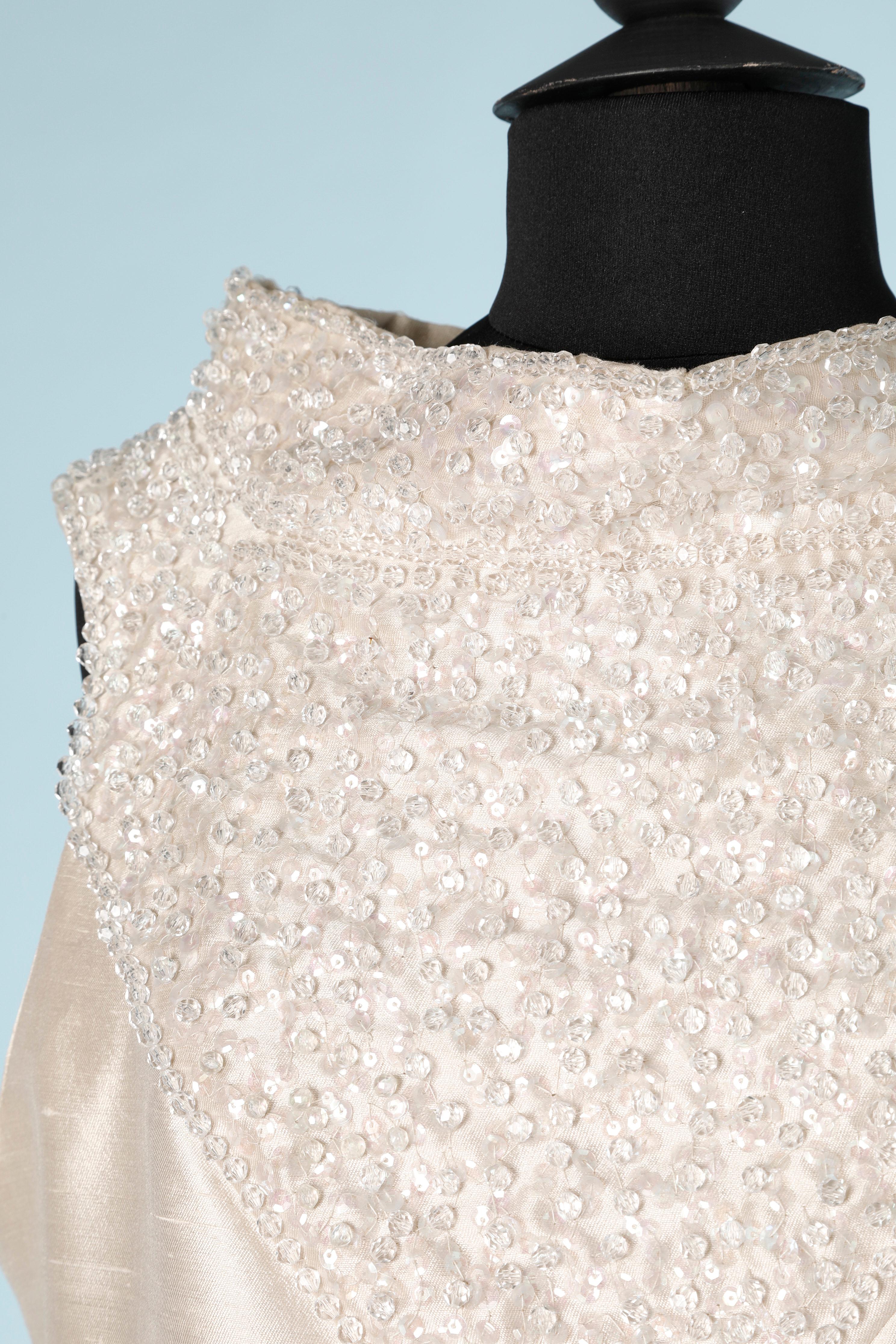 Ivory wild silk cocktail dress with beadwork and sequin. rayon lining. Handmade. Zip and hook&eye closure on the middle back. 
SIZE 40 (Fr) L 