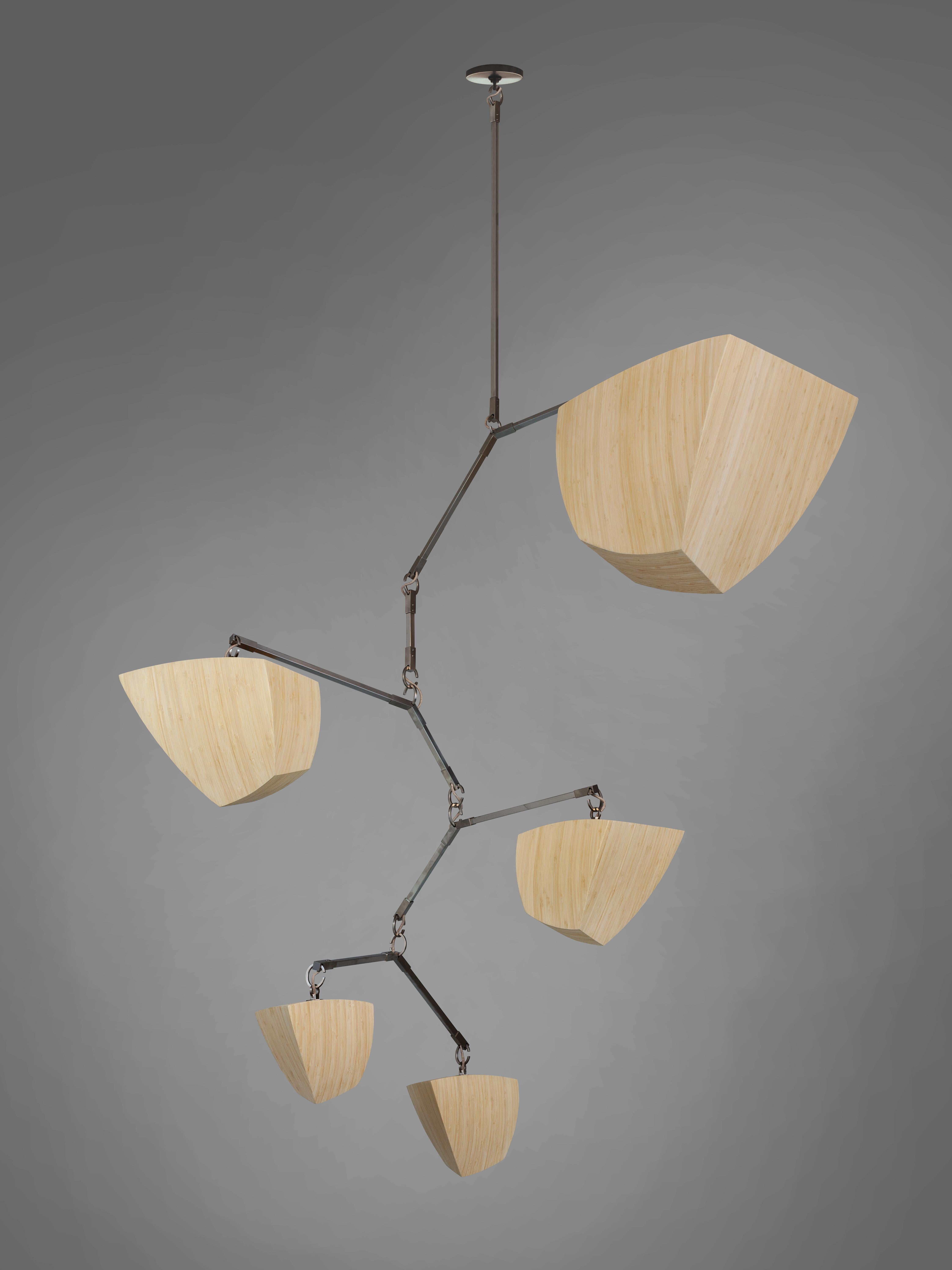 Ivy 5 Bamboo V1 (ABCDF) is a vertical mobile chandelier with 5 glowing bamboo polyhedrons, arranged in size order. 

The Ivy series is a vertically oriented variation which mimics the shape of Ivy vines and it designed for higher volume, taller